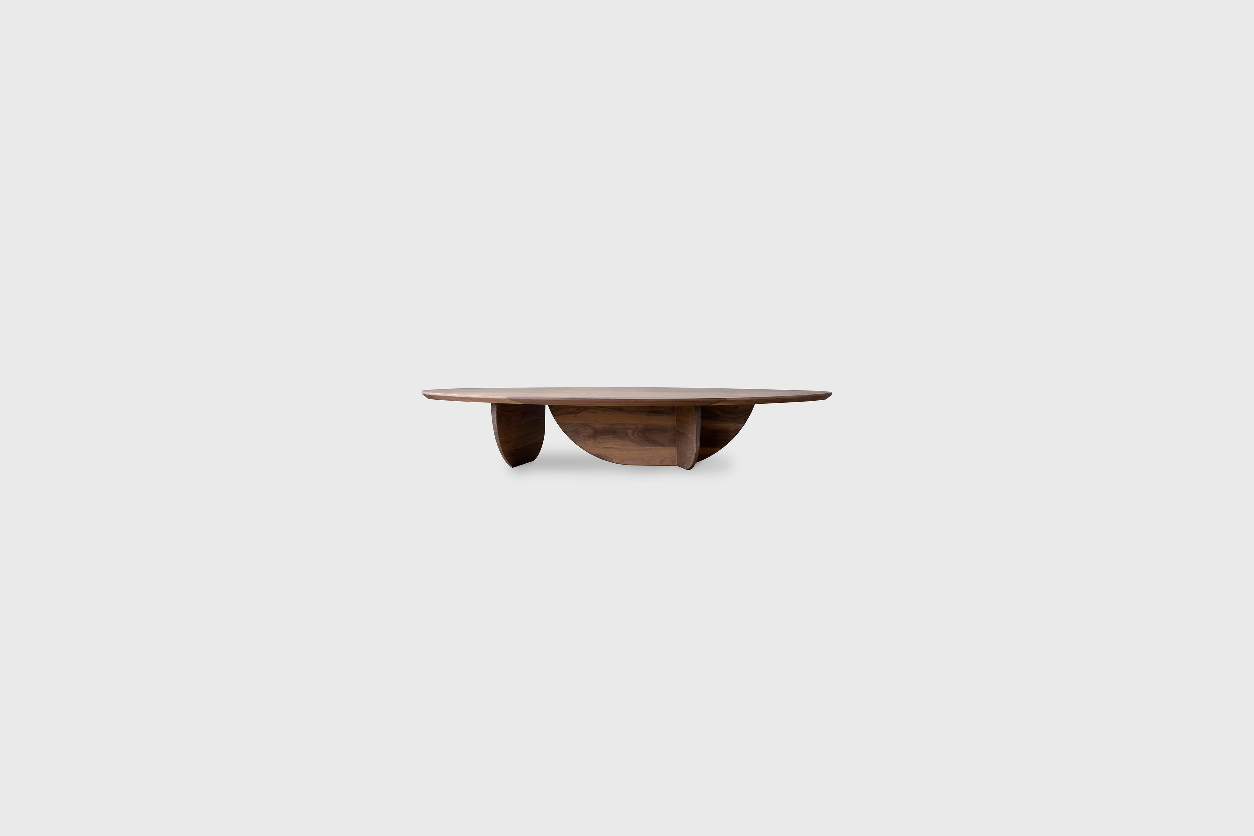 Pebble coffee table II by Atra Design
Dimensions: D 174 x W 77.7 x H 32.2 cm
Materials: Walnut wood.
Also available in other woods; white oiled oak, teak, and charcoal oak. 

Atra Design
We are Atra, a furniture brand produced by Atra form a mexico