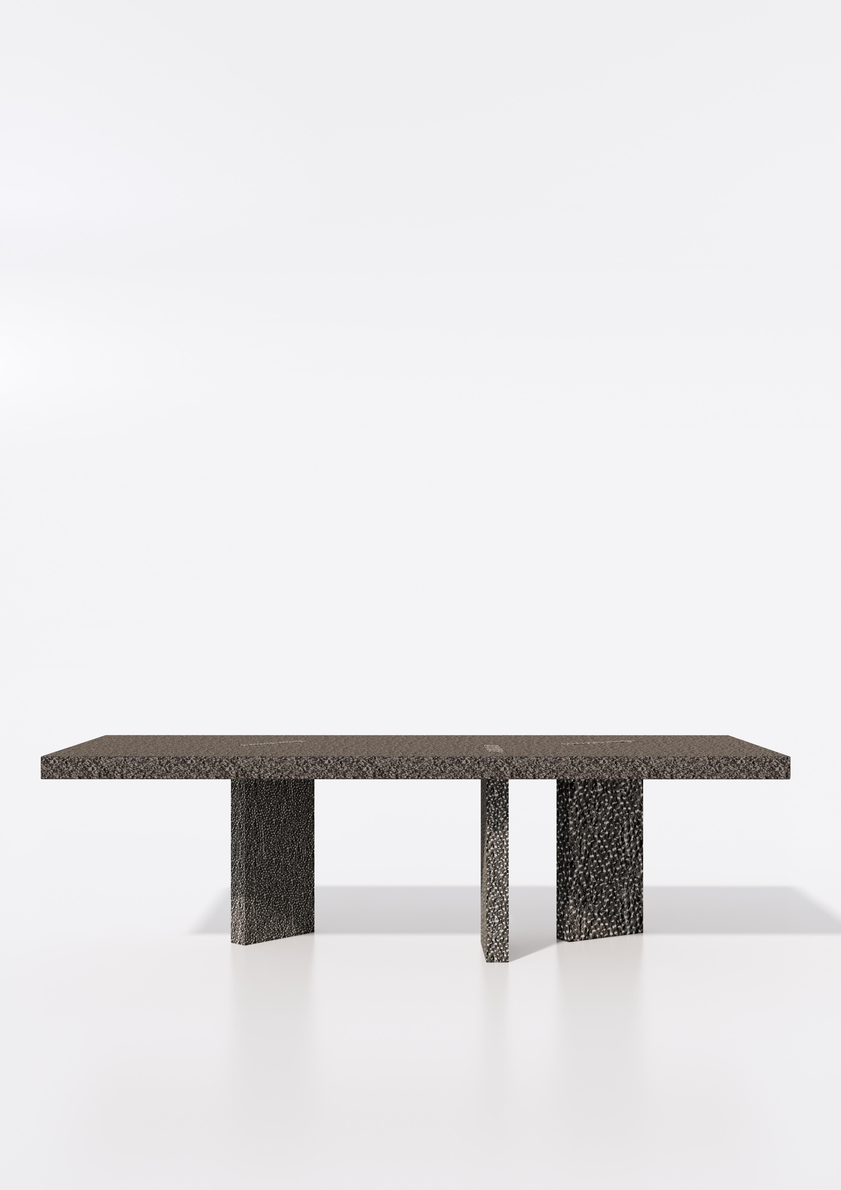 Pebble Dining Table by Studio Gameiro
Dimensions: D 110 x W 260 x H 75 cm.
Materials: Hand-hammered Lecarow stone.

Studio Gameiro is an innovative, multidisciplinary, and design-focused agency that specializes in exploring relationships between