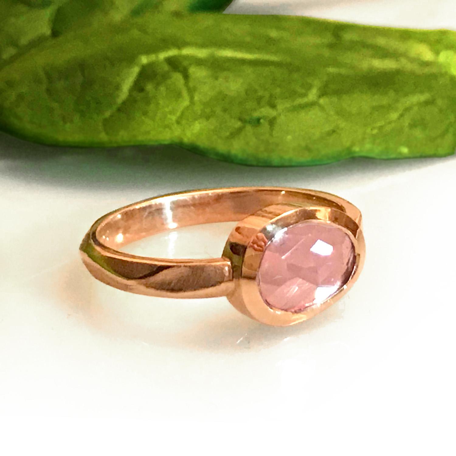 K.Mita's Pebble Ring is made from 18 karat Pink Gold and a pebble shaped 1.34 carat Pink Sapphire. The shank, which features K.Mita's 