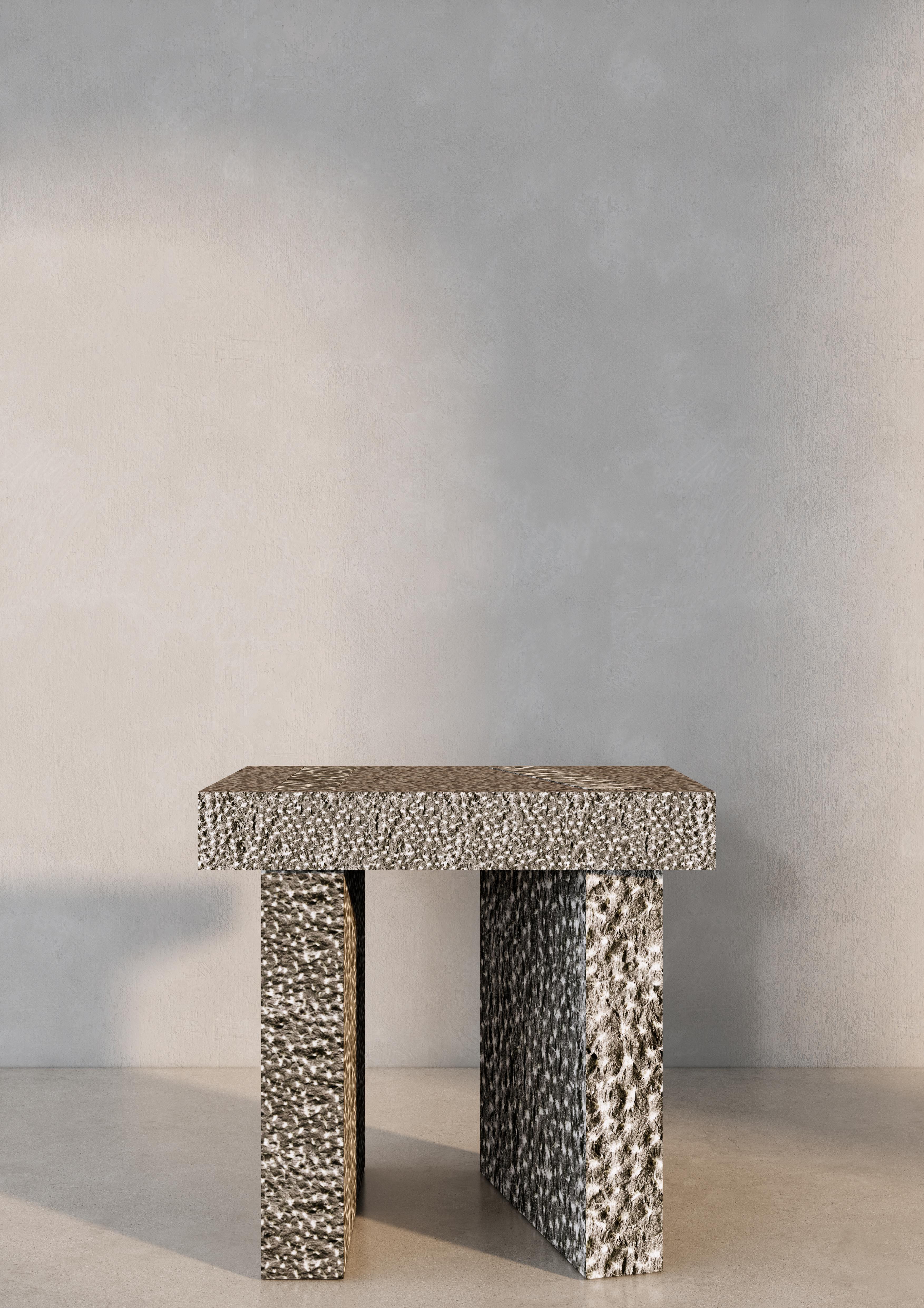 Pebble Side Table by Studio Gameiro
Dimensions: D 40 x W 50 x H 48 cm.
Materials: Hand-hammered Lecarow stone.

Studio Gameiro is an innovative, multidisciplinary, and design-focused agency that specializes in exploring relationships between