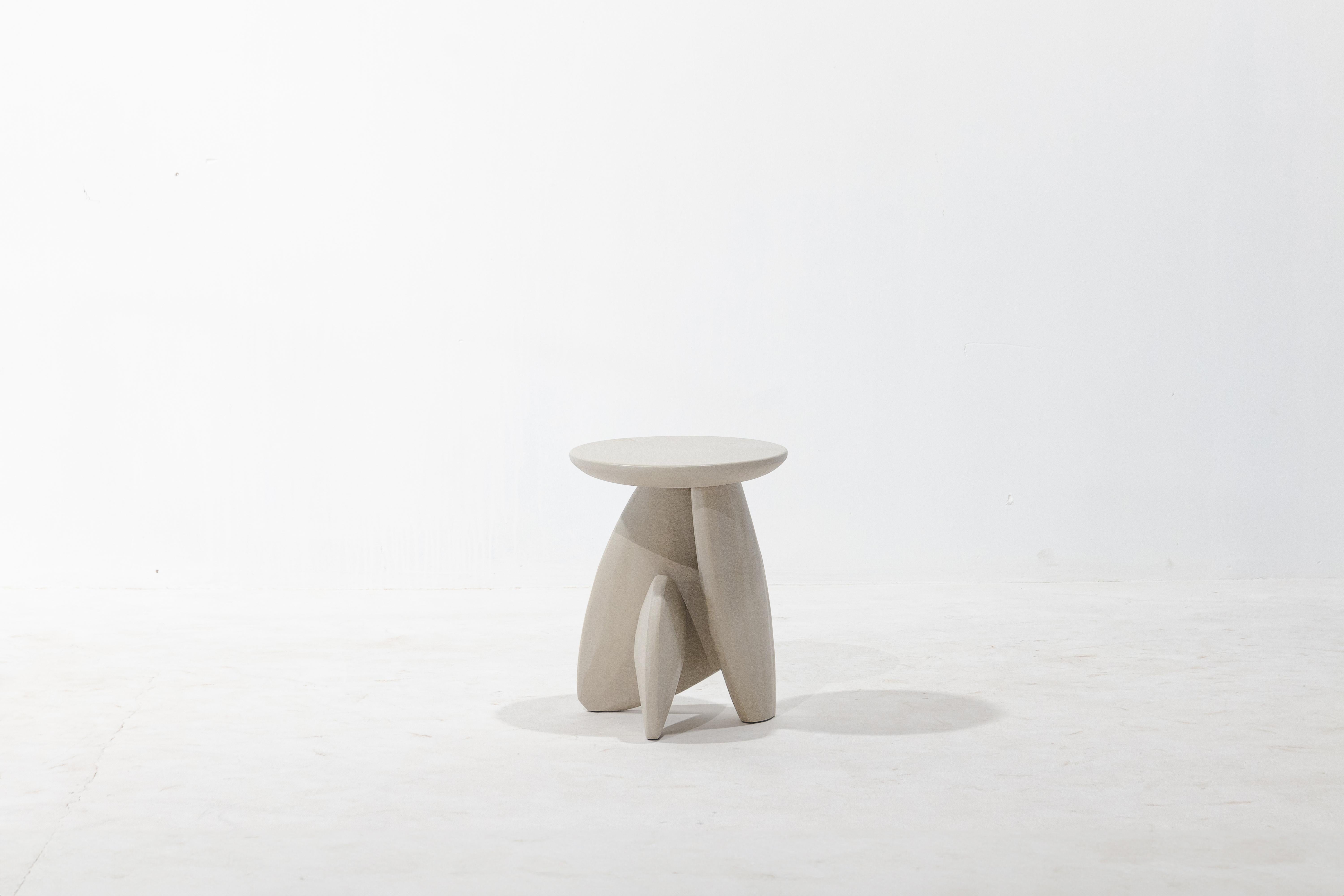 A three-legged wooden stool that looks like the arrangement of rock to form a structure. This work was born from the skill and instinct of a master craftsman where designers give the artisan a chance to create works without a clear plan until