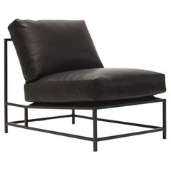 Silla de cuero negro granulado y acero ennegrecido