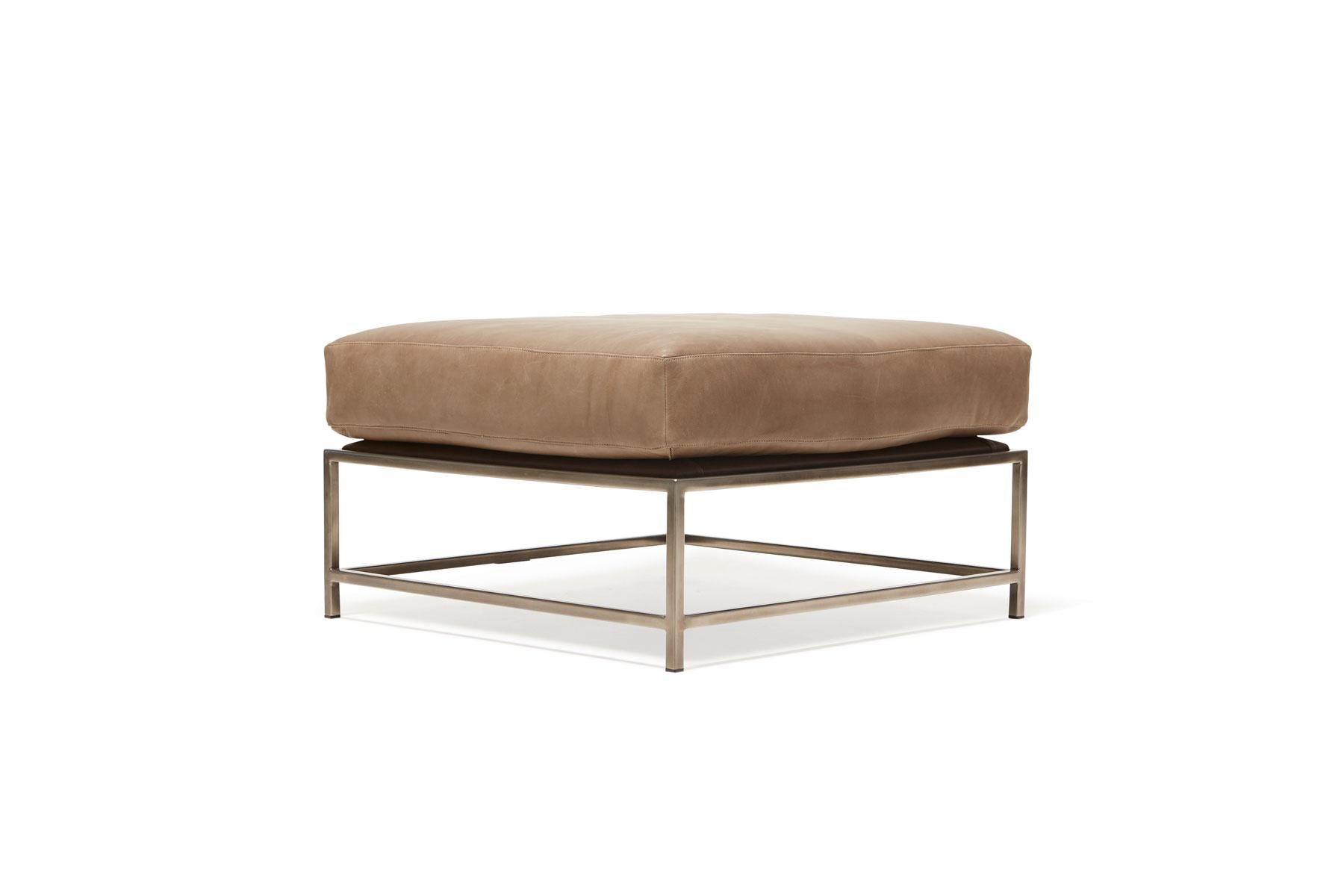The ottoman from Stephen Kenn's Inheritance Collection is a versatile piece to add a lounge element to your seating arrangement.

This ottoman is upholstered in a pebbled leather from the Harness collection by Moore & Giles. The foam cushion has