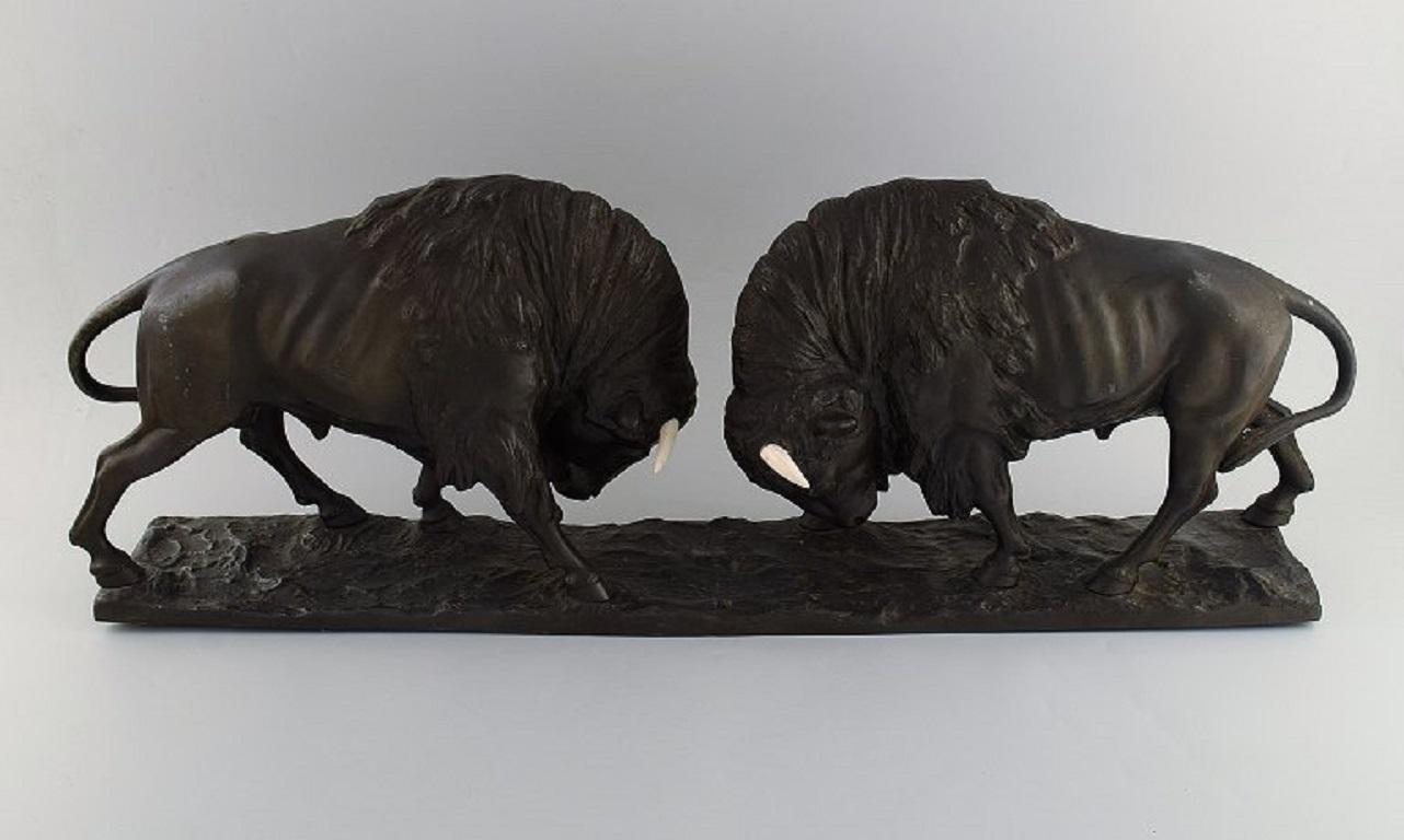 Patinated Peder Marius Jensen (1883 - 1925). Colossal sculpture. Fighting bisons.
