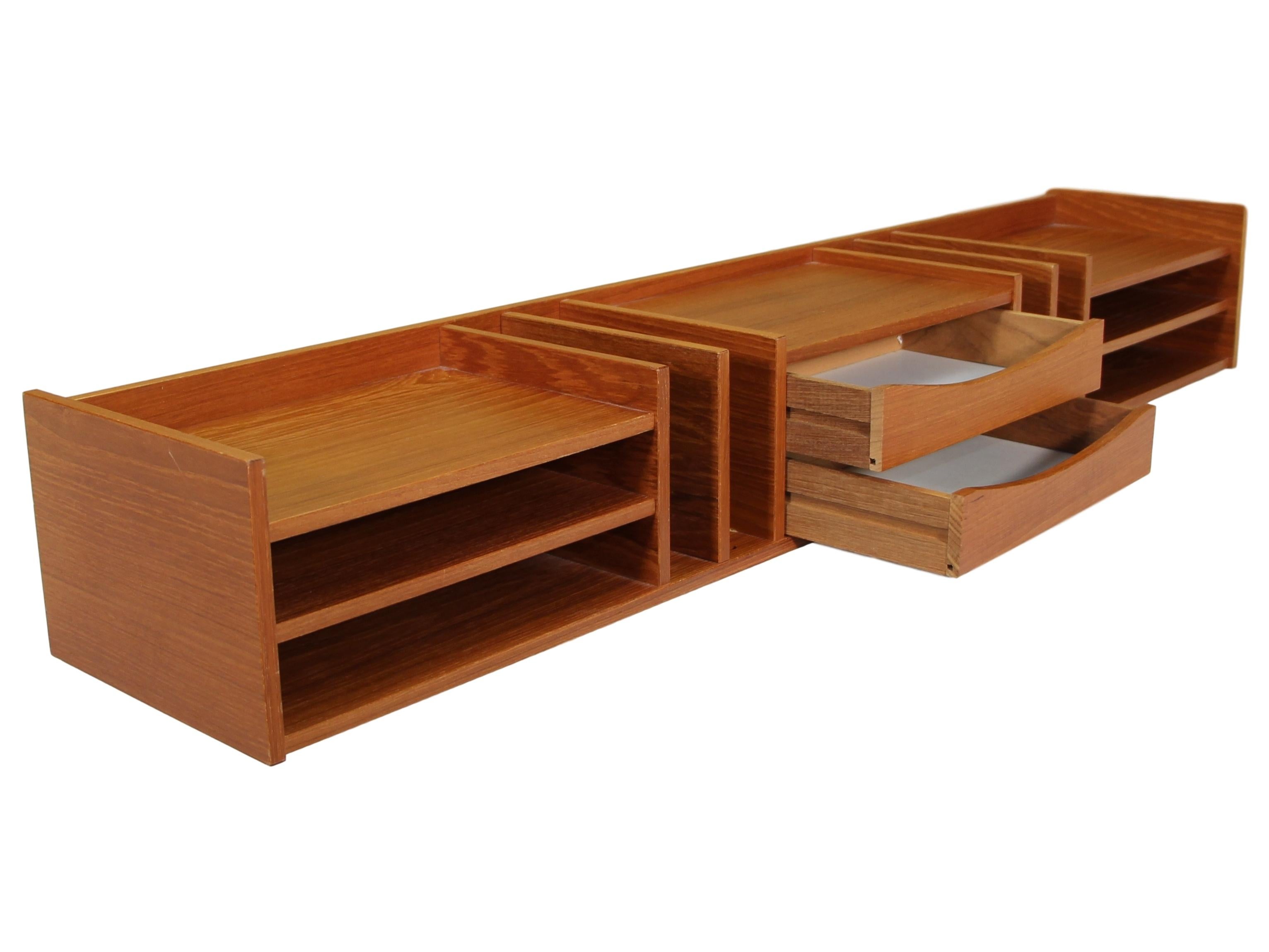 Stunning Mid-Century Modern Pedersen & Hansen Danish teak desktop organizer with 2 center drawers.

Very good vintage condition. There is a chip on the veneer on the right back corner. There are signs of wear consistent with age and use. Please