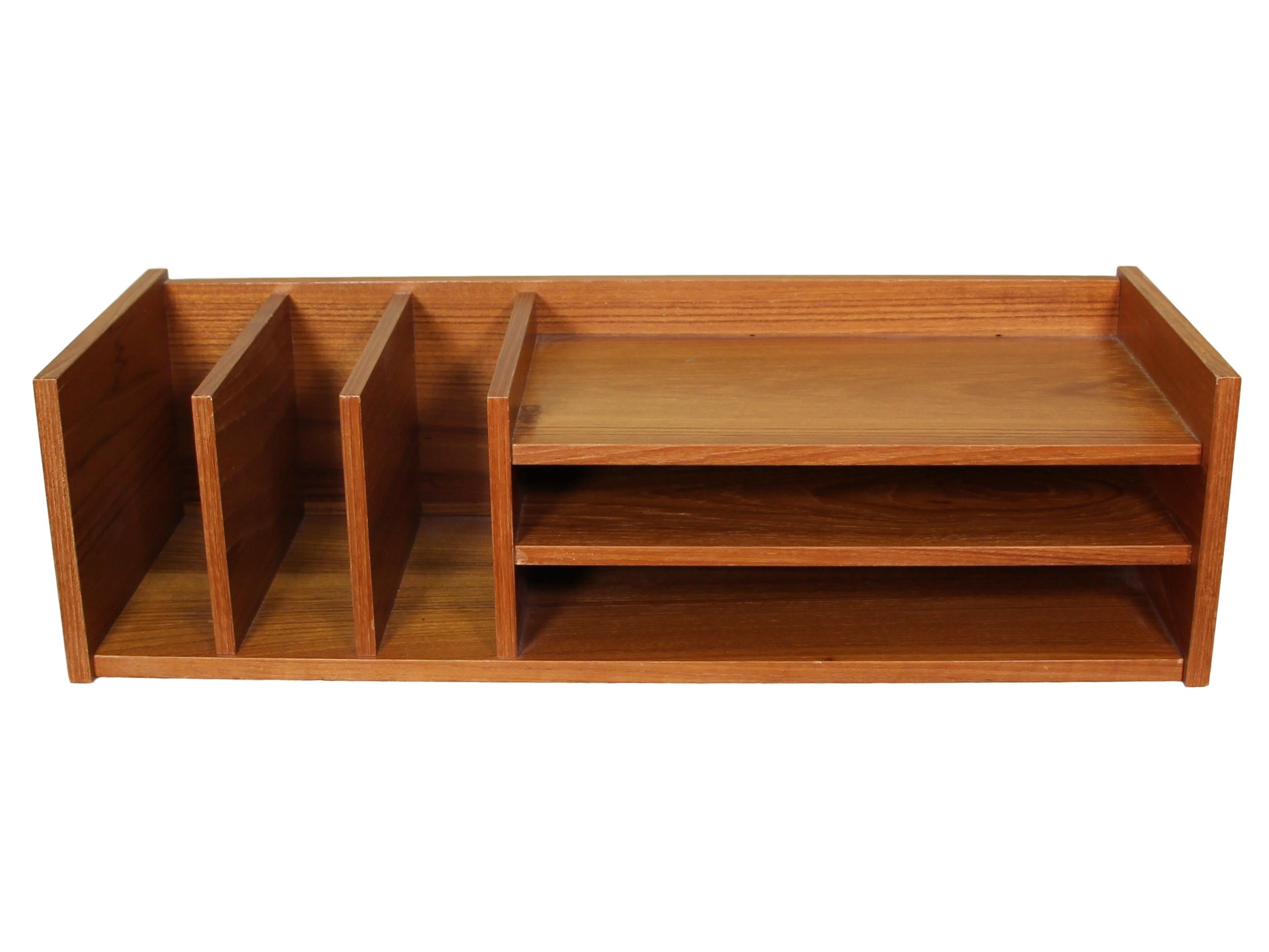 Stunning Mid-Century Modern Pedersen & Hansen Danish teak desktop organizer with multiple dividers.

Very good vintage condition. There is a discolored mark on the top shelf. There are signs of wear consistent with age and use. Please see
