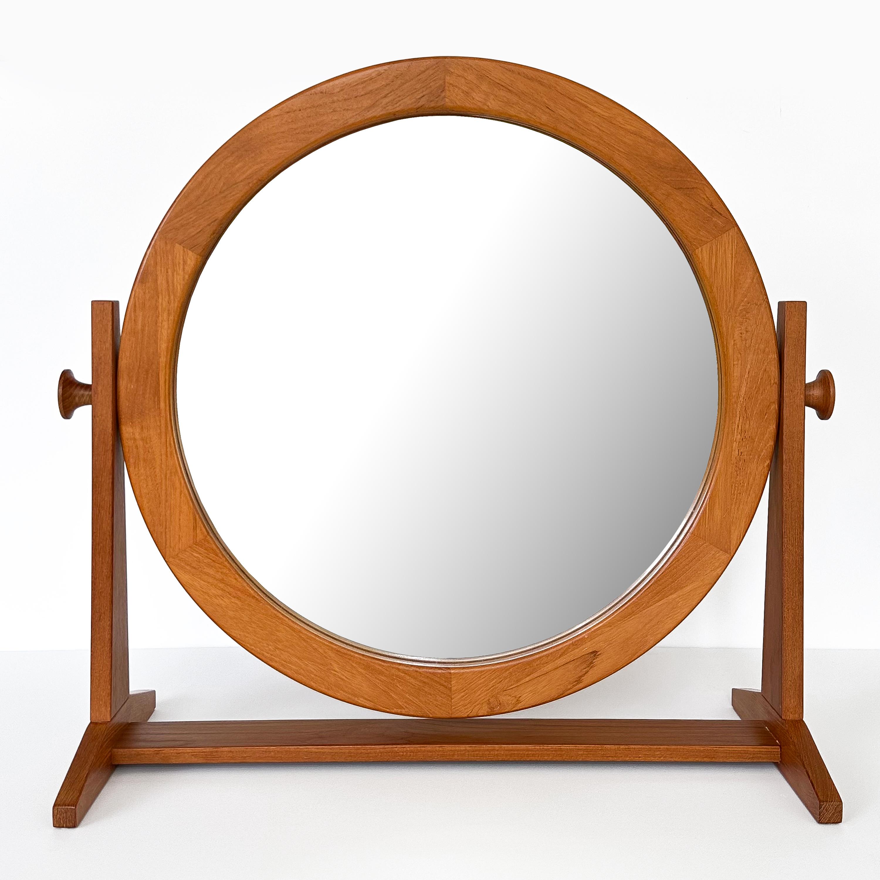 Transform your personal space with this exquisite, large tabletop vanity mirror by Pedersen & Hansen, Denmark, circa 1970s. A true symbol of Danish design sensibility, this mirror combines practicality and aesthetics in a piece that stands the test