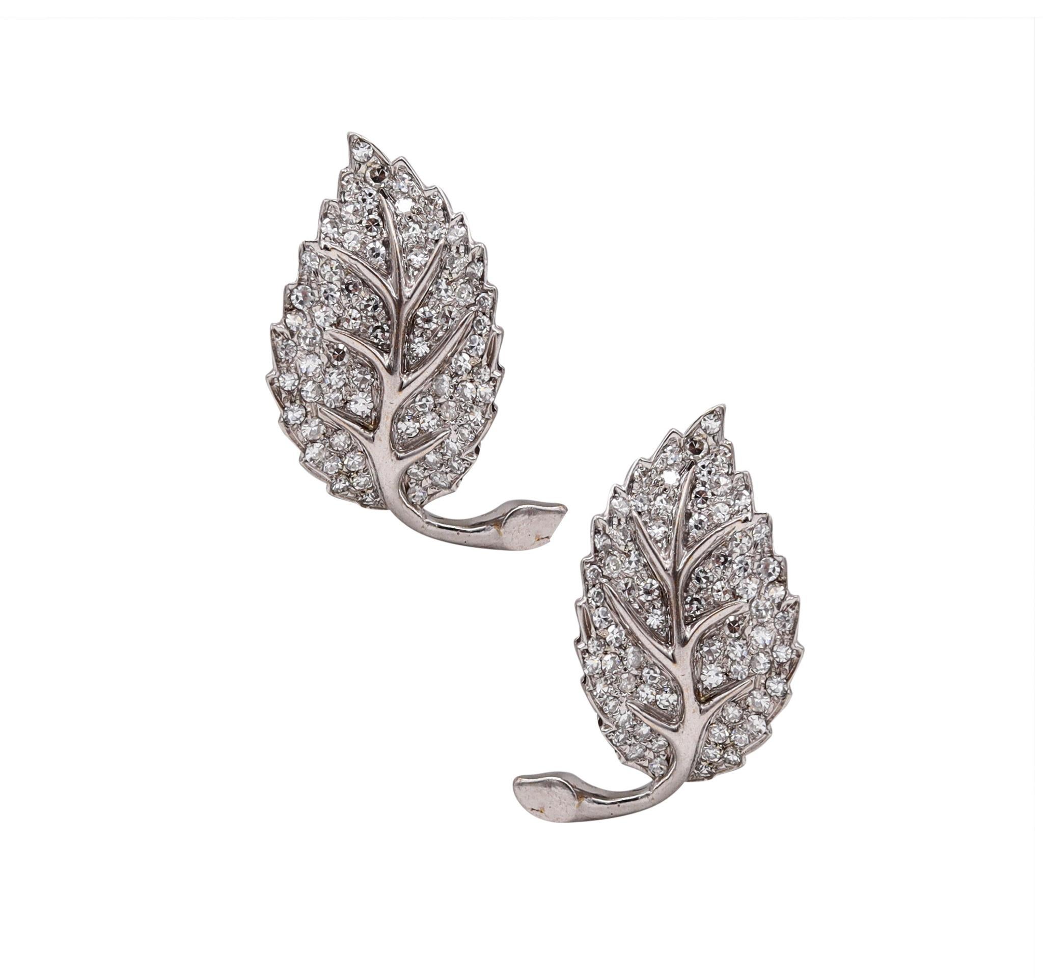 Art Deco Leaf earrings designed by Gino Pederzani.

Gorgeous vintage pieces, created in Milano Italy, by the famed jewelry house of Pederzani, back in the late 1940's. This mirrored pair has been crafted with Art-Deco patterns in solid .900/.999
