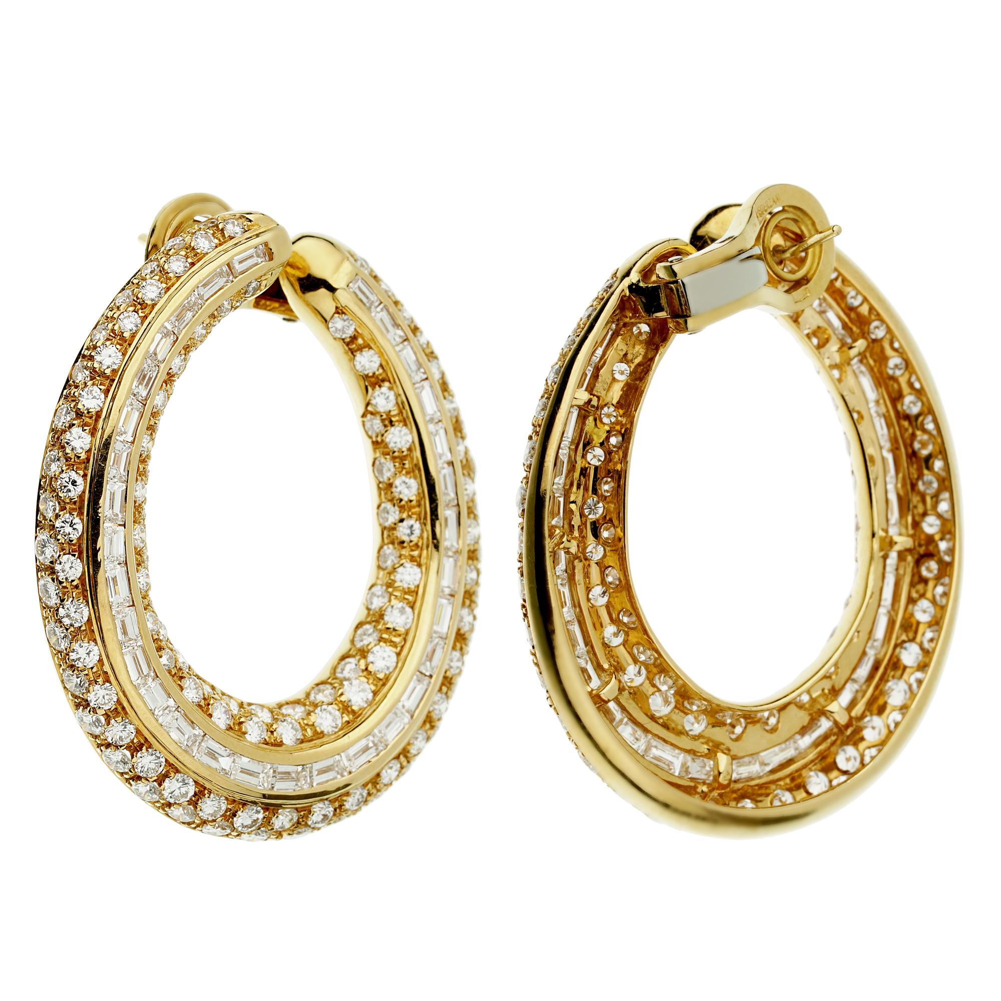 An incredible pair of Pederzani hoop earrings showcasing the finest round brilliant cut and baguette diamonds set in 18k yellow gold. The hoops have a total weight of appx 5.5cts and measures 1.69