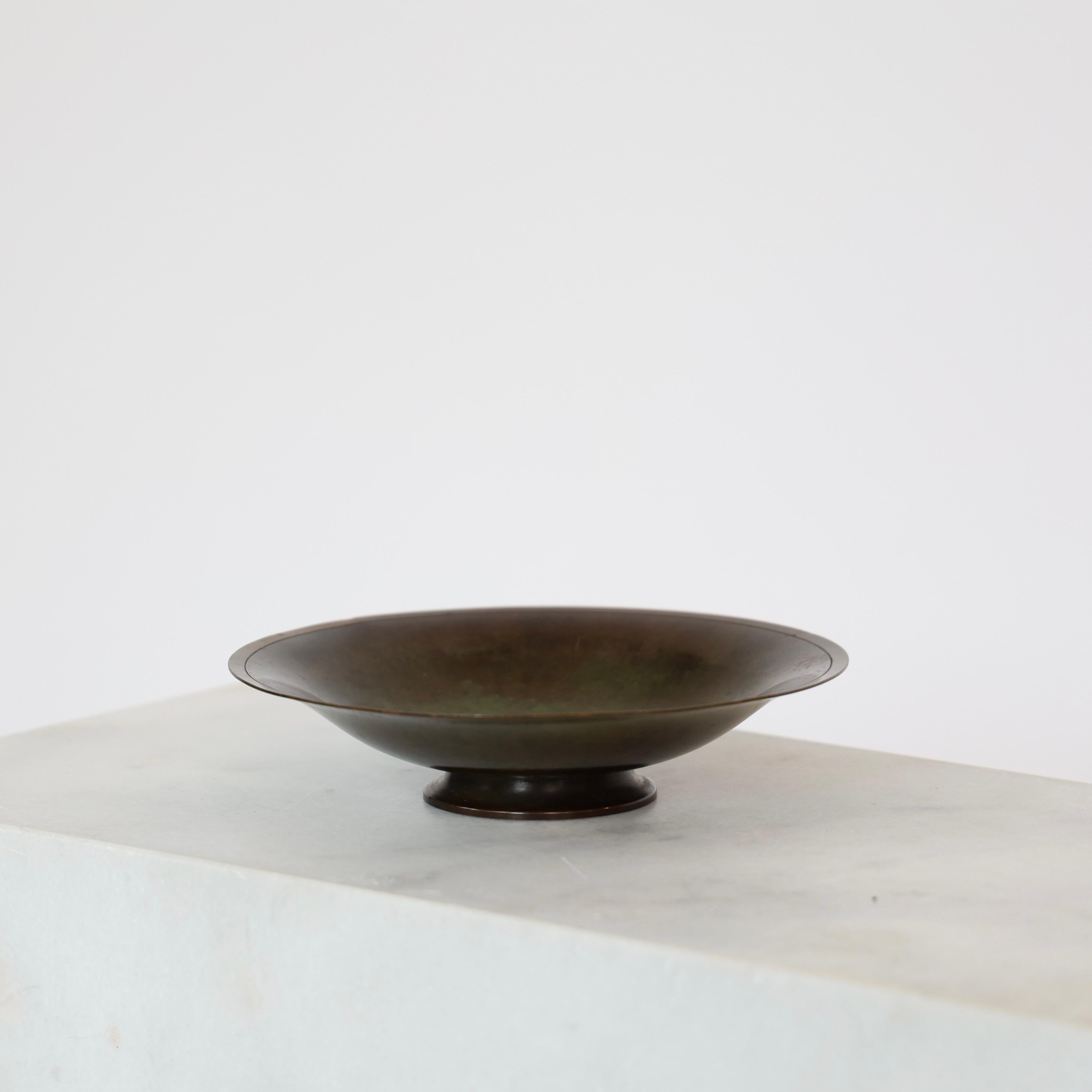 Elegant Light-Bronze Bowl on Foot designed by Just Andersen in 1935. 

* Bowl on foot in light-bronze alloy and chasing in the rim
* Designer: Just Andersen
* Model: LB1385X
* Year: 1936
* Condition: Good vintage condition. Makers engravings intact.