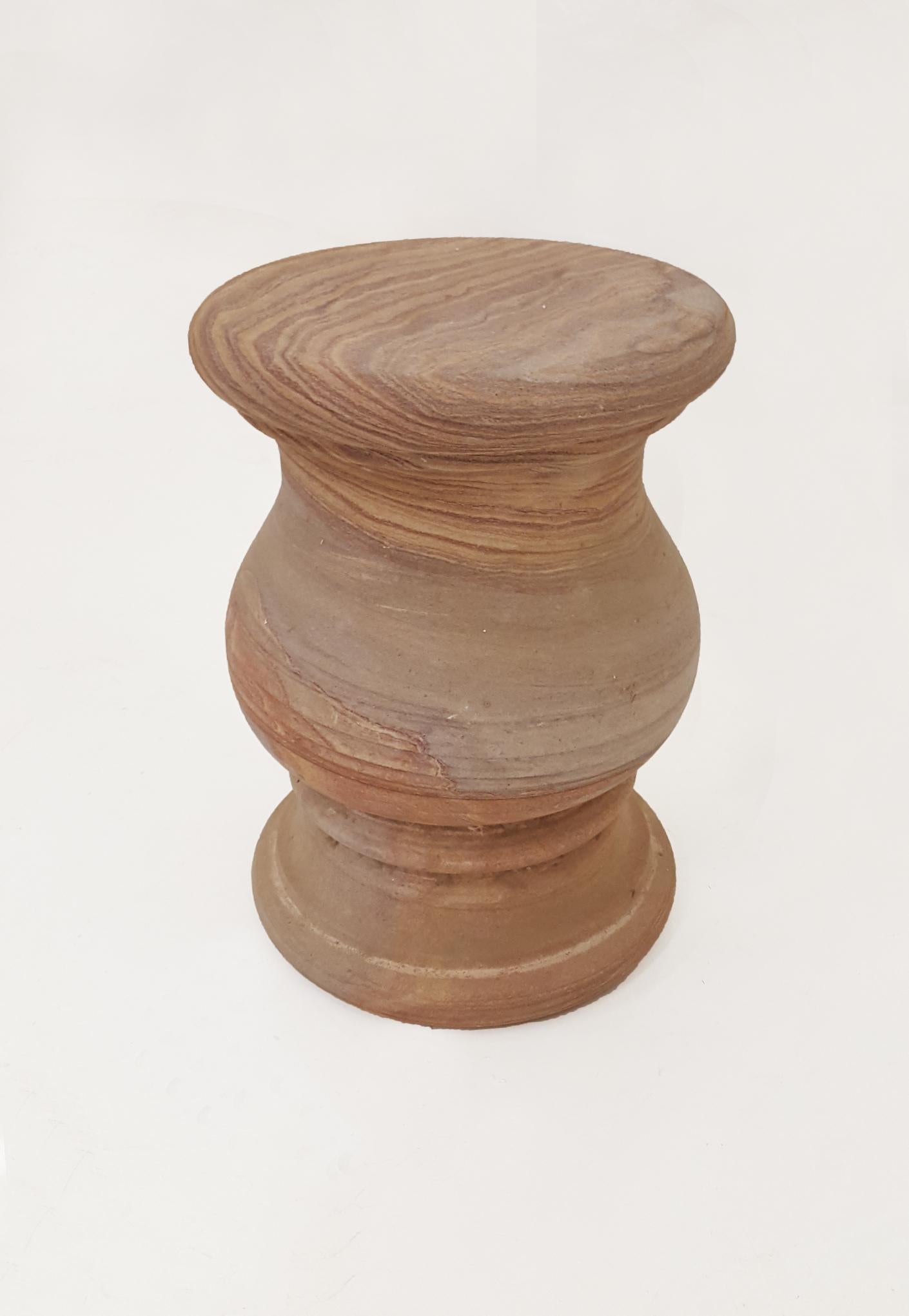 This simple round pedestal stands out when made in the rare and unique Rainbow Teakwood stone. An occasional piece, a side table, or a garden element, this versatile piece can fit wherever you like.
 

Round Pedestal Side Table
Size- 12
