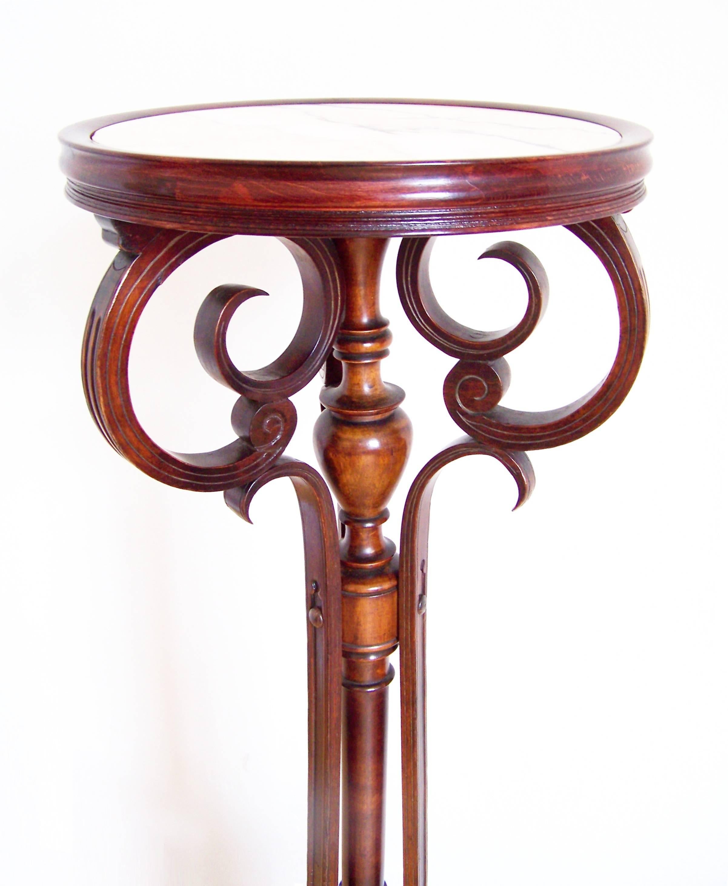 Pedestal was manufactured in Austria by company Jacob and Josef Kohn at the beginning of the 19th century. It is a rare product of this company, intended for luxury saloons. The only known depiction of the pedestal is in the sales catalog from 1904.