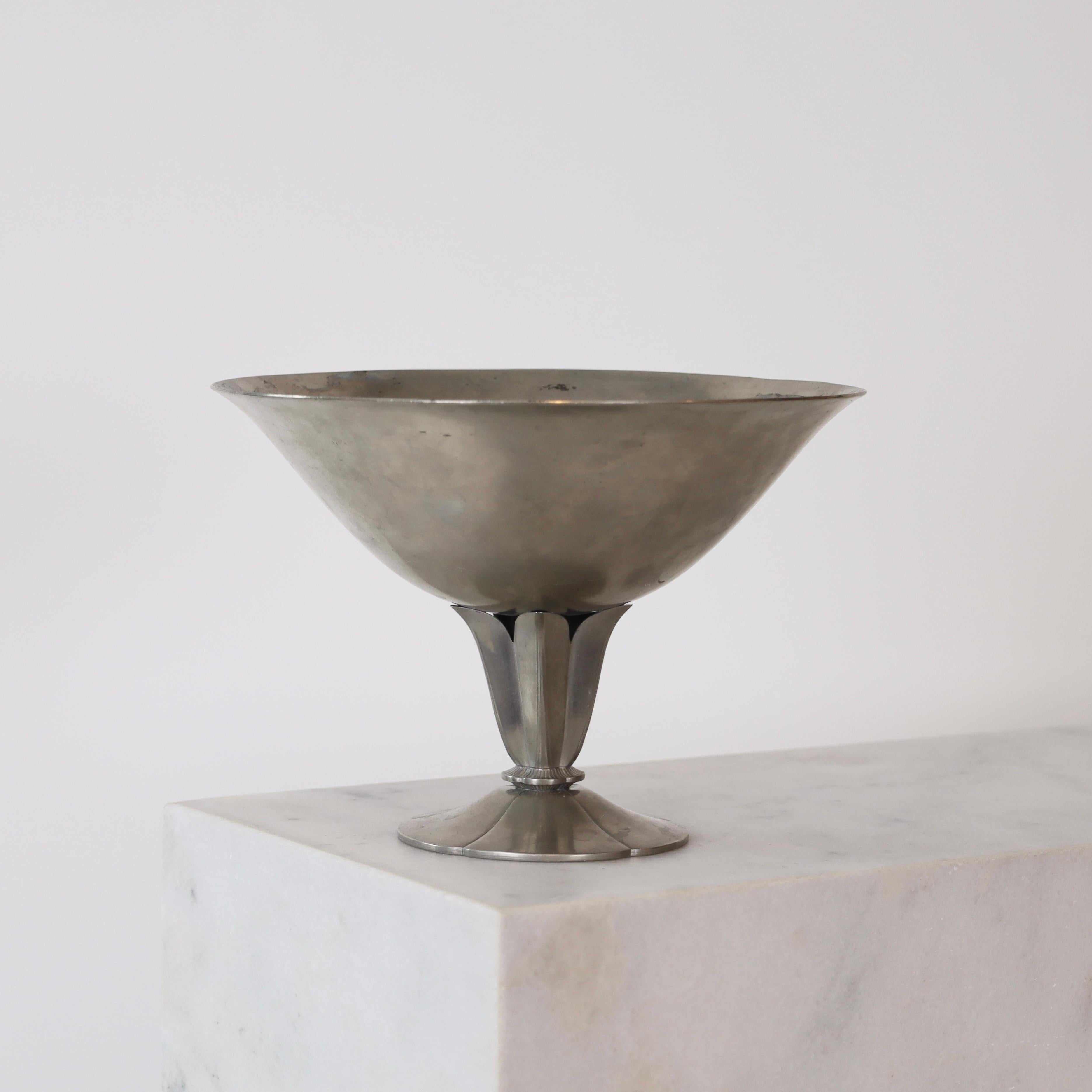Pedestal Pewter bowl made by Just Andersen in 1930. An exquisite piece for a beautiful place.

* A round Pewter on foot
* Designer: Just Andersen
* Model: 140
* Year: 1930
* Condition: Good vintage condition. Makers engraving intact. Few marks and