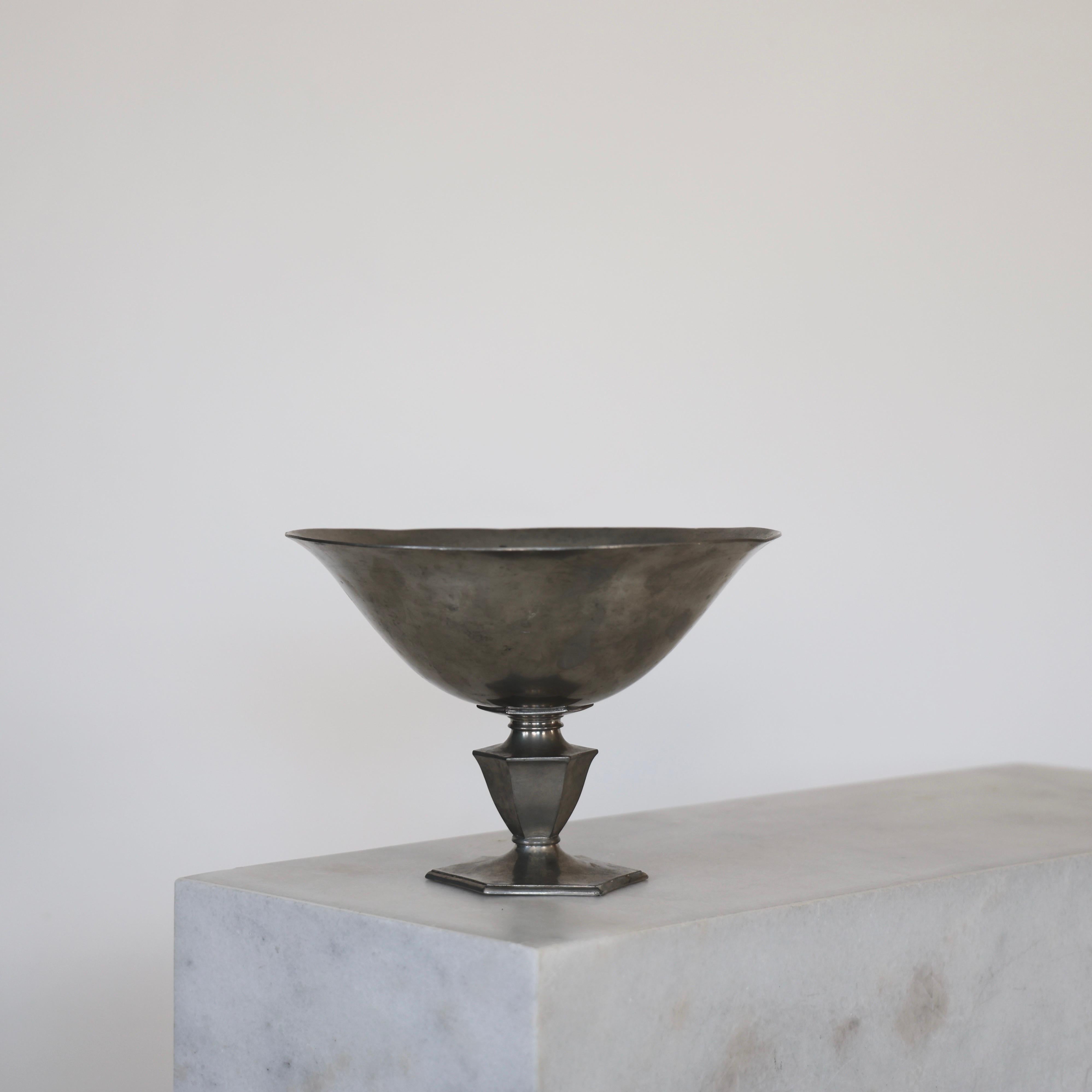 Pedestal Pewter Bowl made by Just Andersen in 1929. An exquisite piece for a beautiful place.

* A round pewter bowl on foot
* Designer: Just Andersen
* Model: 159
* Year: 1929
* Condition: Fair vintage condition. Makers engraving intact. Marks,