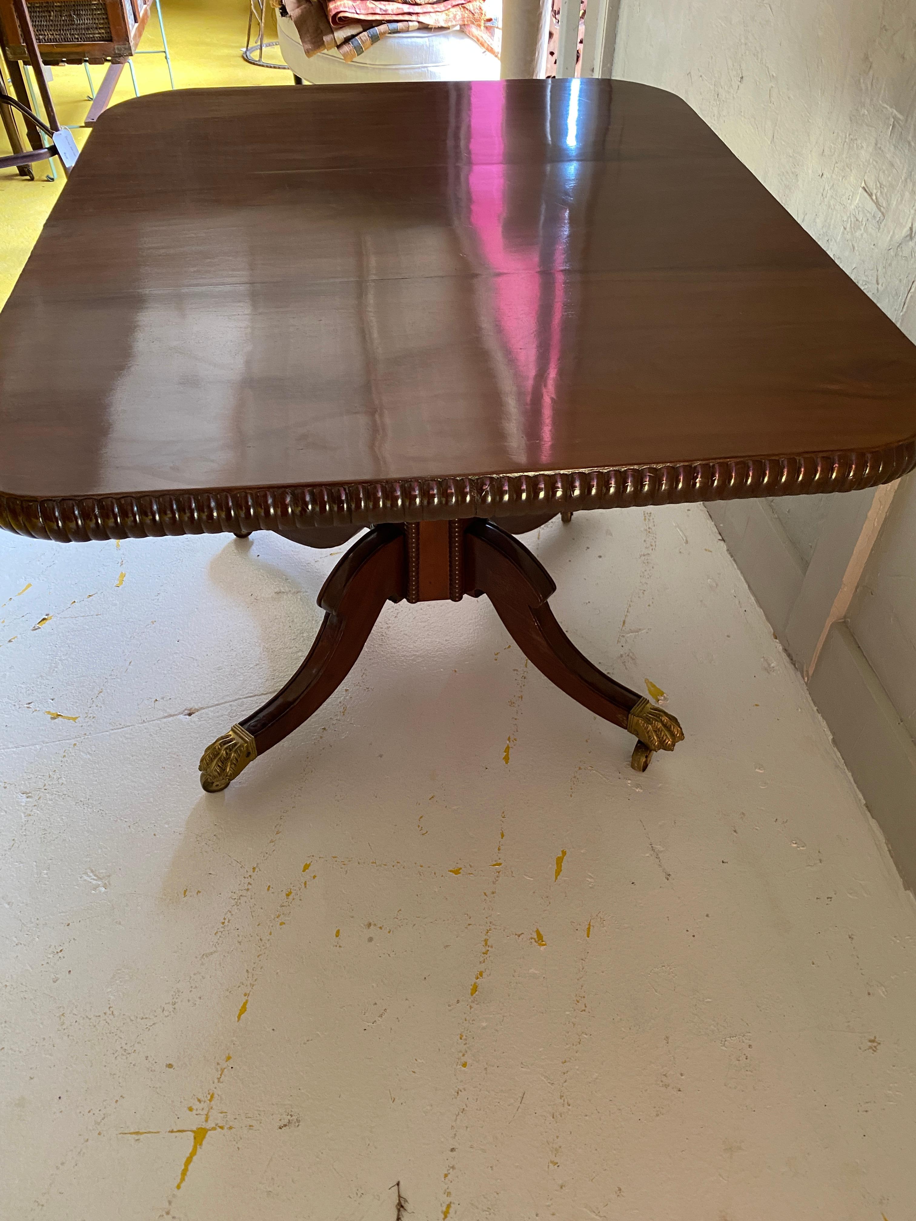 Mahogany Pedestal Rectangle Center Table with Gadrooning Banding & Brass Claw Foot For Sale
