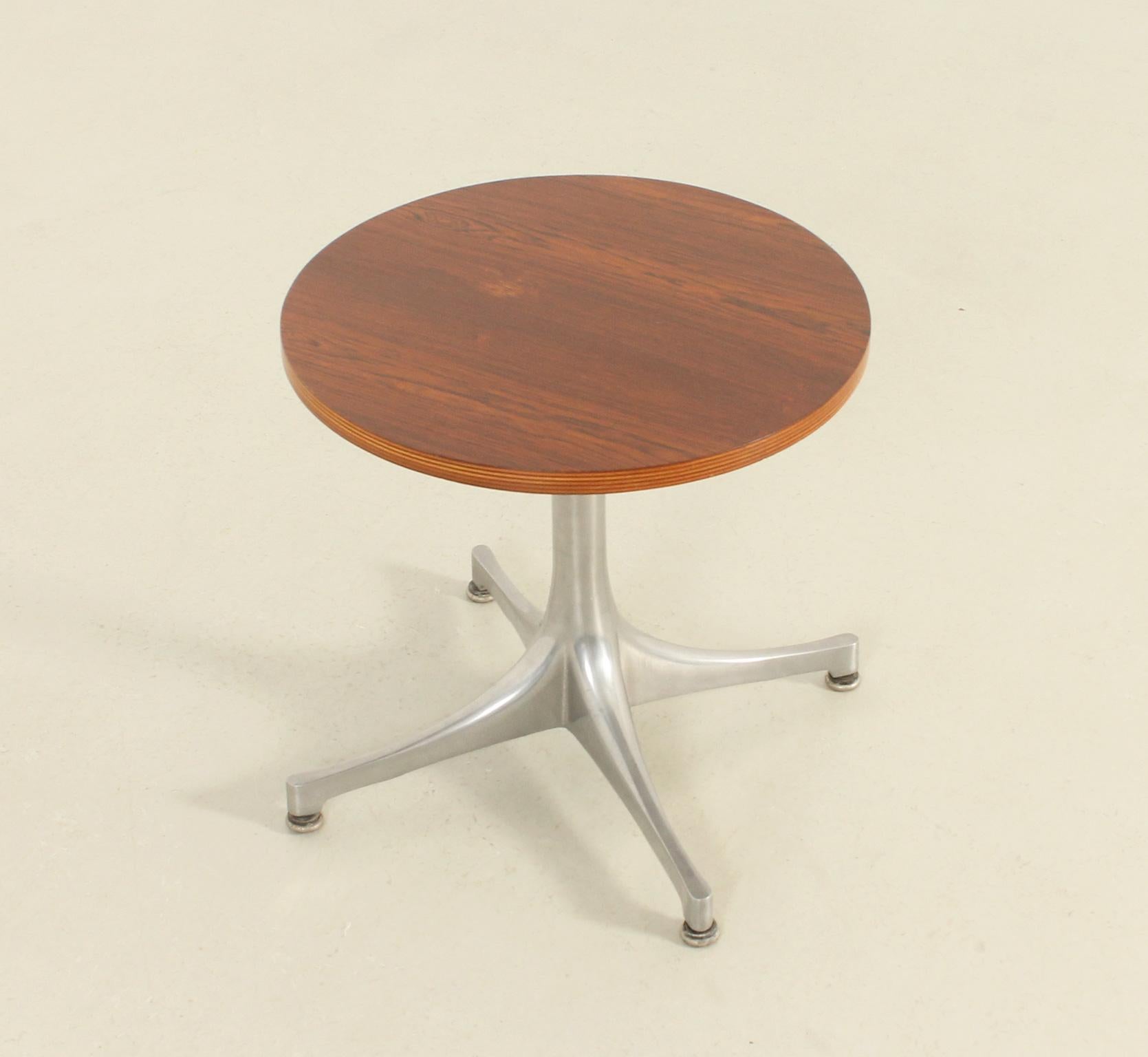 Pedestal side table designed in 1954 by George Nelson for Herman Miller, USA. Veneered wood top with polished aluminum base. See our other matching large table with white laminate top. 