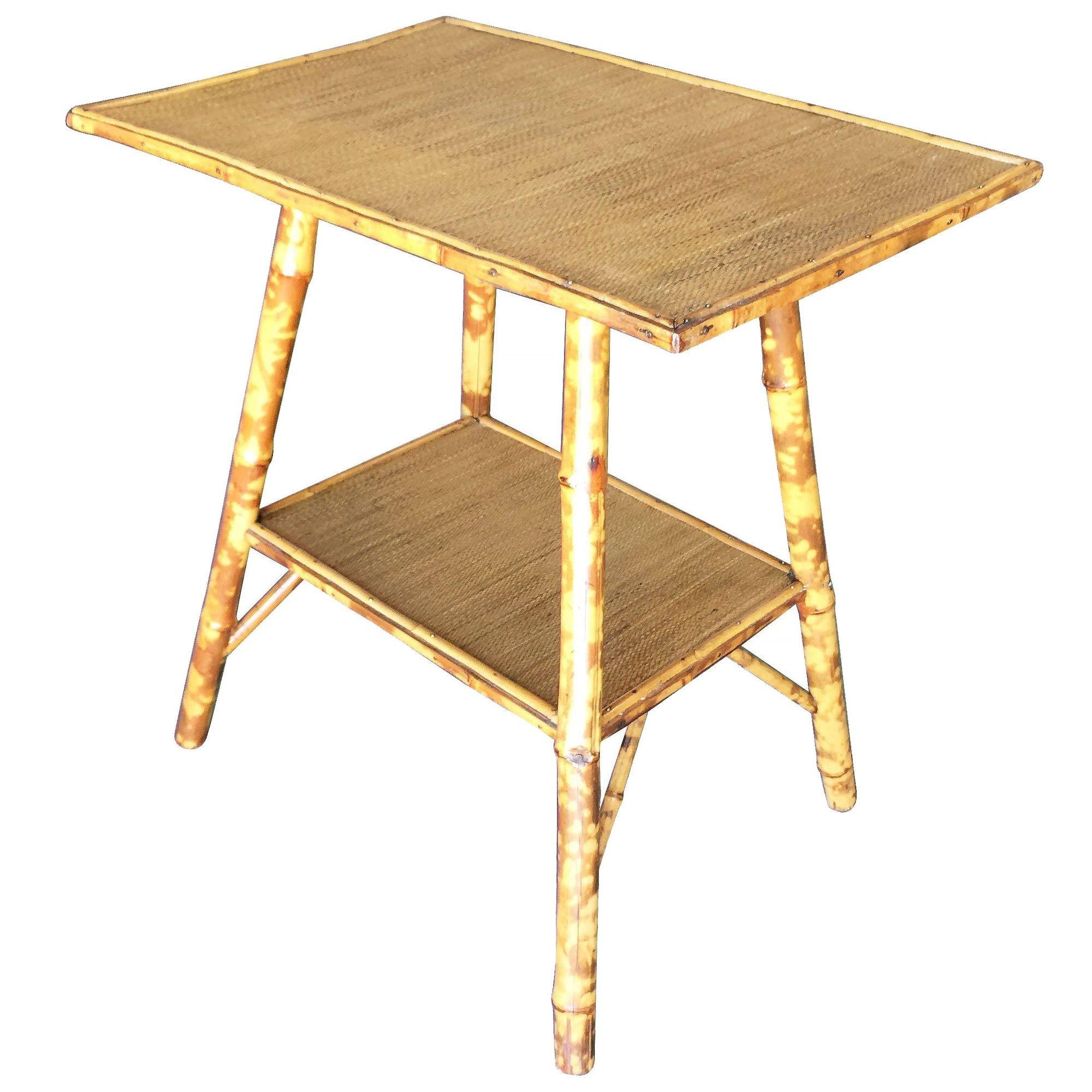 Antique Ascetically Movement tiger bamboo pedestal side table with rice mat top and secondary bottom shelf.

Restored to new for you.

All rattan, bamboo and wicker furniture has been painstakingly refurbished to the highest standards with the best