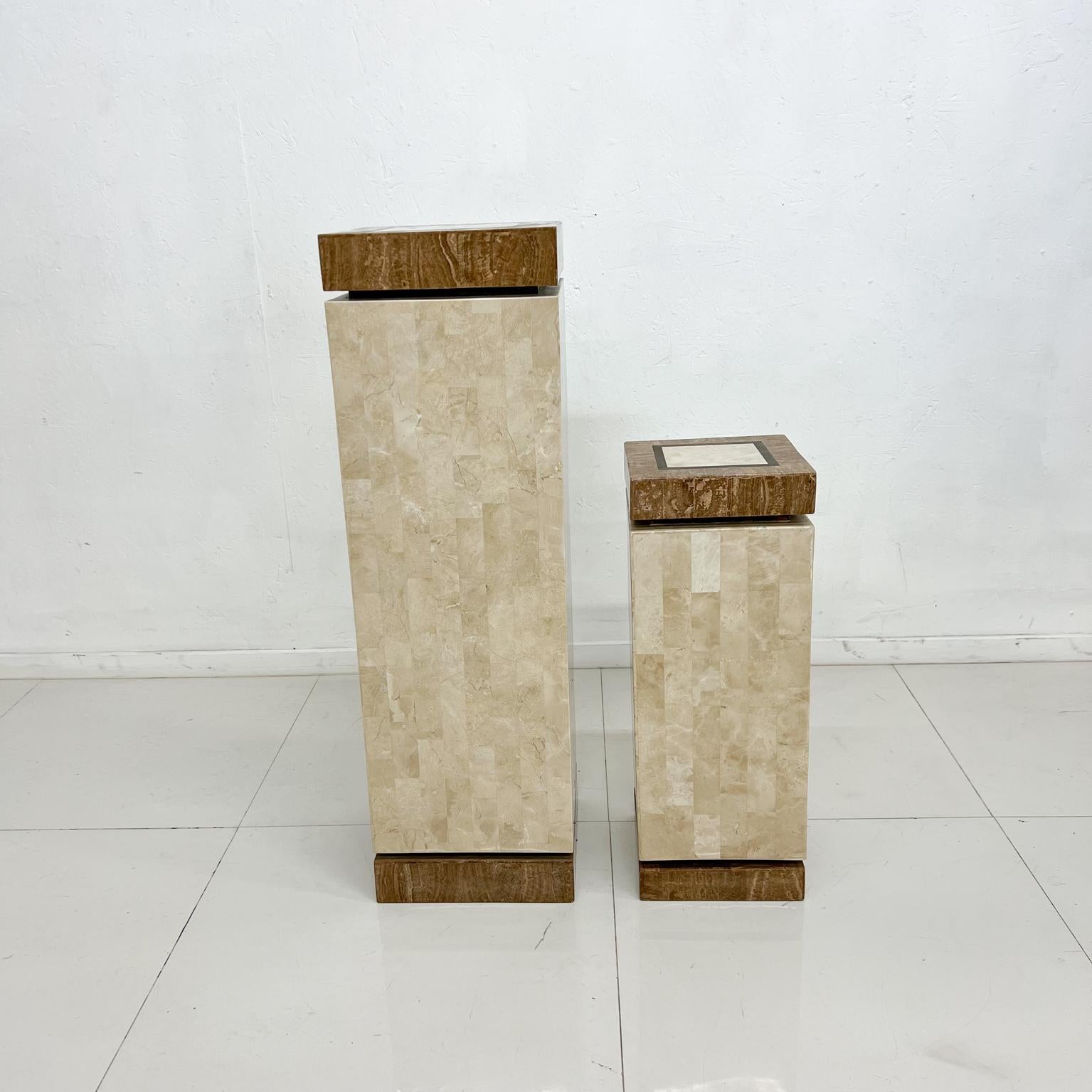 Modern Tessellated Pedestal Column Plant Stand Side Table Set 1988
Tall and short pedestal
Philippines 1980s
Two-tone Stone Tan and Brass Inlay
Maker label. Made in Philippines for Mission Furniture Los Angeles
Similar Maitland Smith and Karl