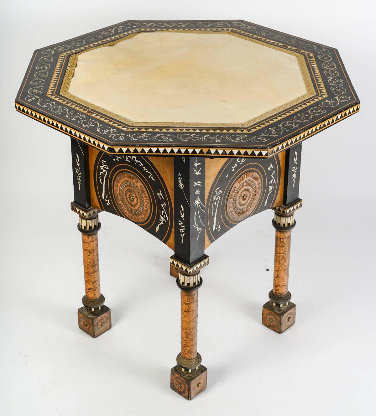 Pedestal table by Carlo Bugatti, 19th Century, Wood, mother of pearl, copper and parchment marquetry.

Carlo Bugatti pedestal table, late 19th century or early 20th century, inlaid with wood, bone, mother-of-pearl, copper and parchment (partial