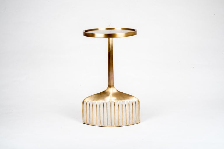 The pedestal side table in small is the perfect accent piece due to its sleek and light aesthetic. The small size is inlaid in cream shagreen and bronze patina brass. The large size is also available that is inlaid on the top surface with black