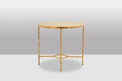 Pedestal table with bamboo-style gold metal base and gray marble top