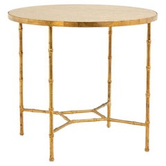 Pedestal table with bamboo-style gold metal base and gray marble top
