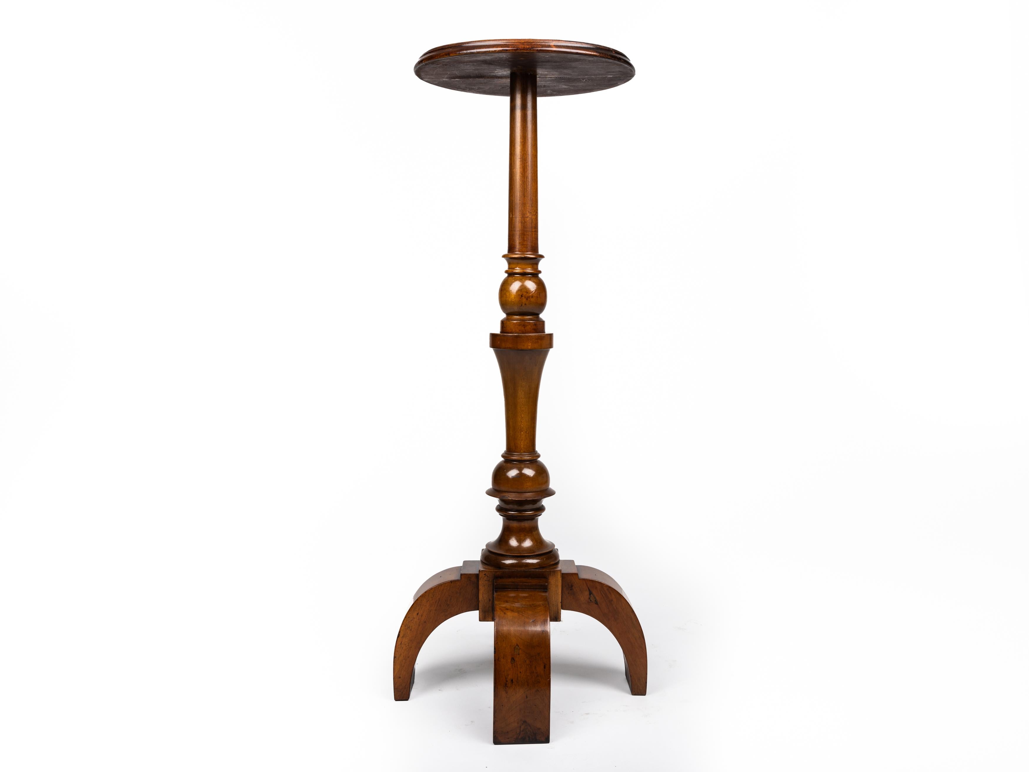 Very special pedestal, made in the late 19. century, around 1880 in France. 

This column has a particularly beautiful structure, the base consists of 4 strongly curved feet, which merge into a column. This is structured by ball decoration and the