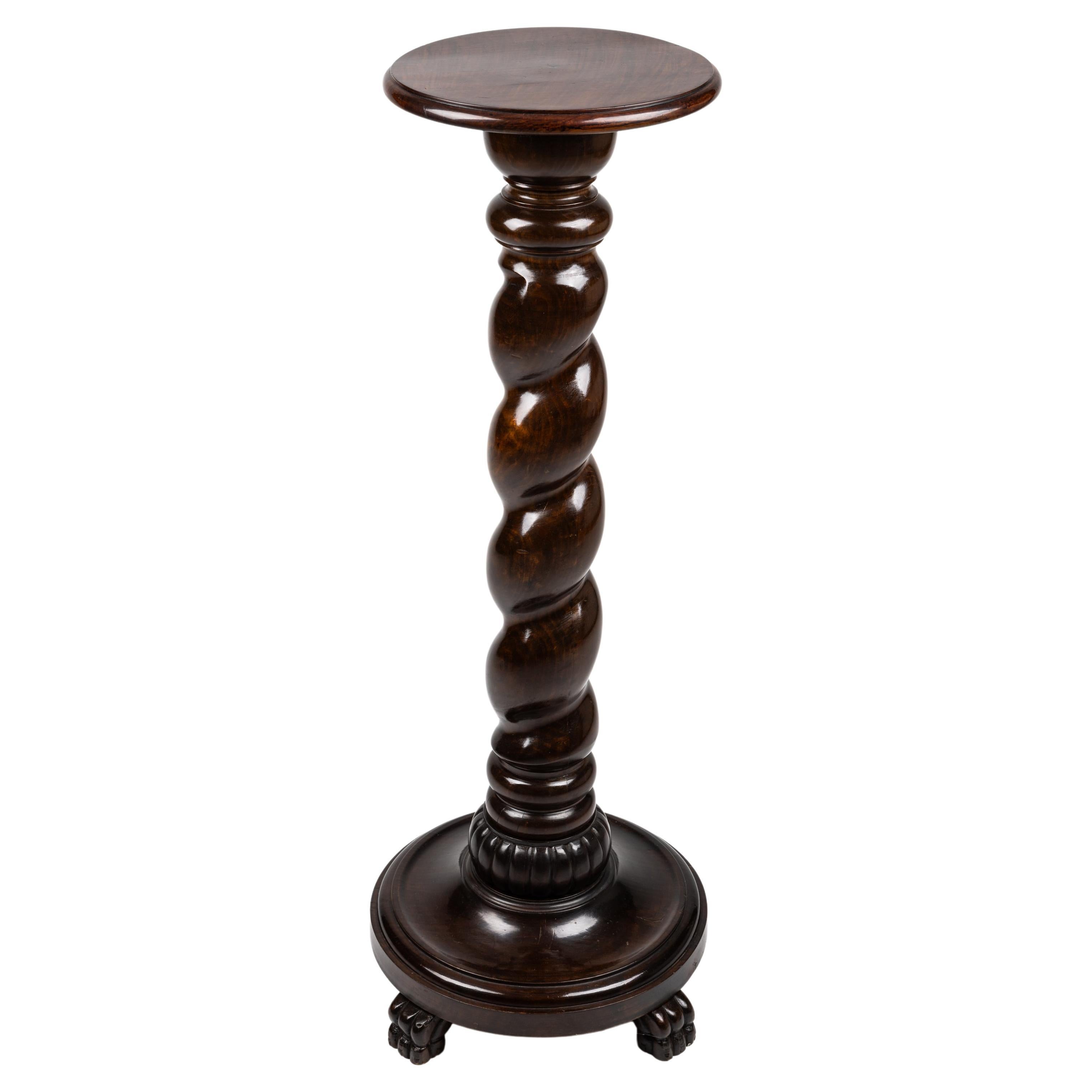 Very special pedestal, made in the late 19. century, around 1880 in Austria. 

This column has a particularly beautiful structure, the base is formed by lion paws around a round, bulbous slab that descends into an impressive, beautifully hand-carved