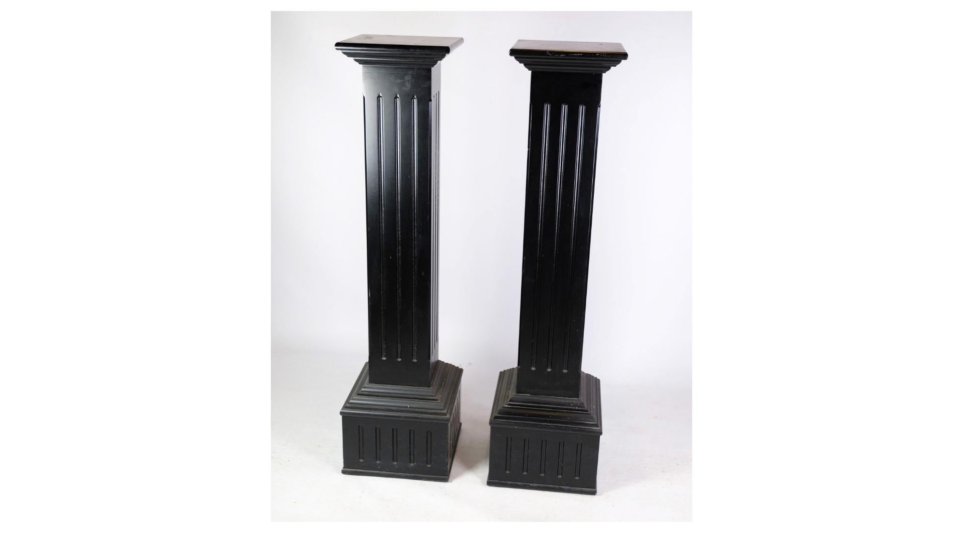 The pedestals with black paint, designed in the Louis Seize style from around the 1980s, are a striking fusion of classic elegance and contemporary flair. Inspired by the opulent aesthetic of 18th-century French design, these pedestals feature