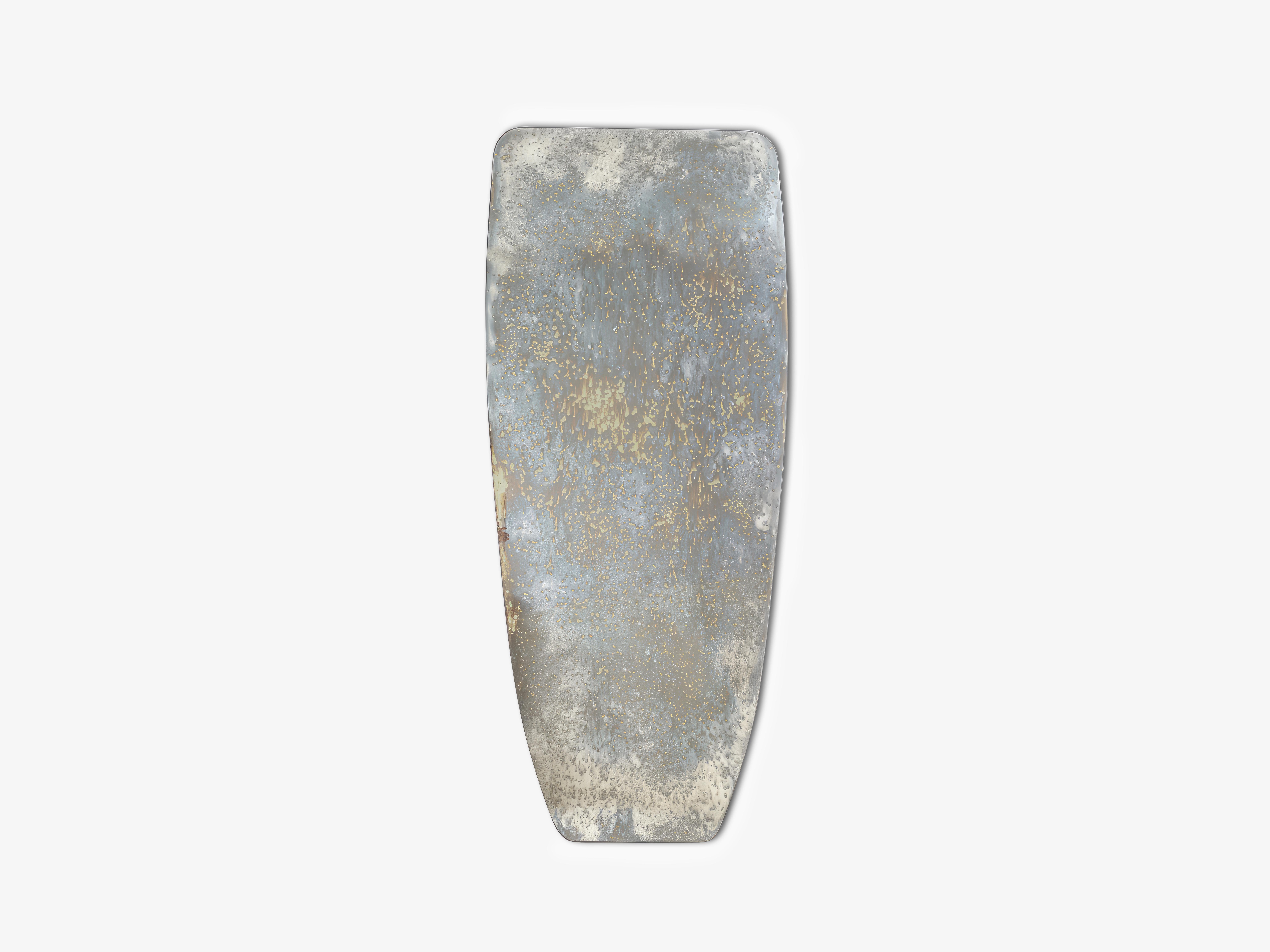 Pedra Mirror by OHLA STUDIO
Dimensions: D 3 x W 93 x H 220 cm 
Materials: Oxidized mirror, brushed steel. 
60 kg

Inspired in the pattern by the lichen formations that naturally grow on rocky surfaces, the shape recalls megalithic sculptures, one of