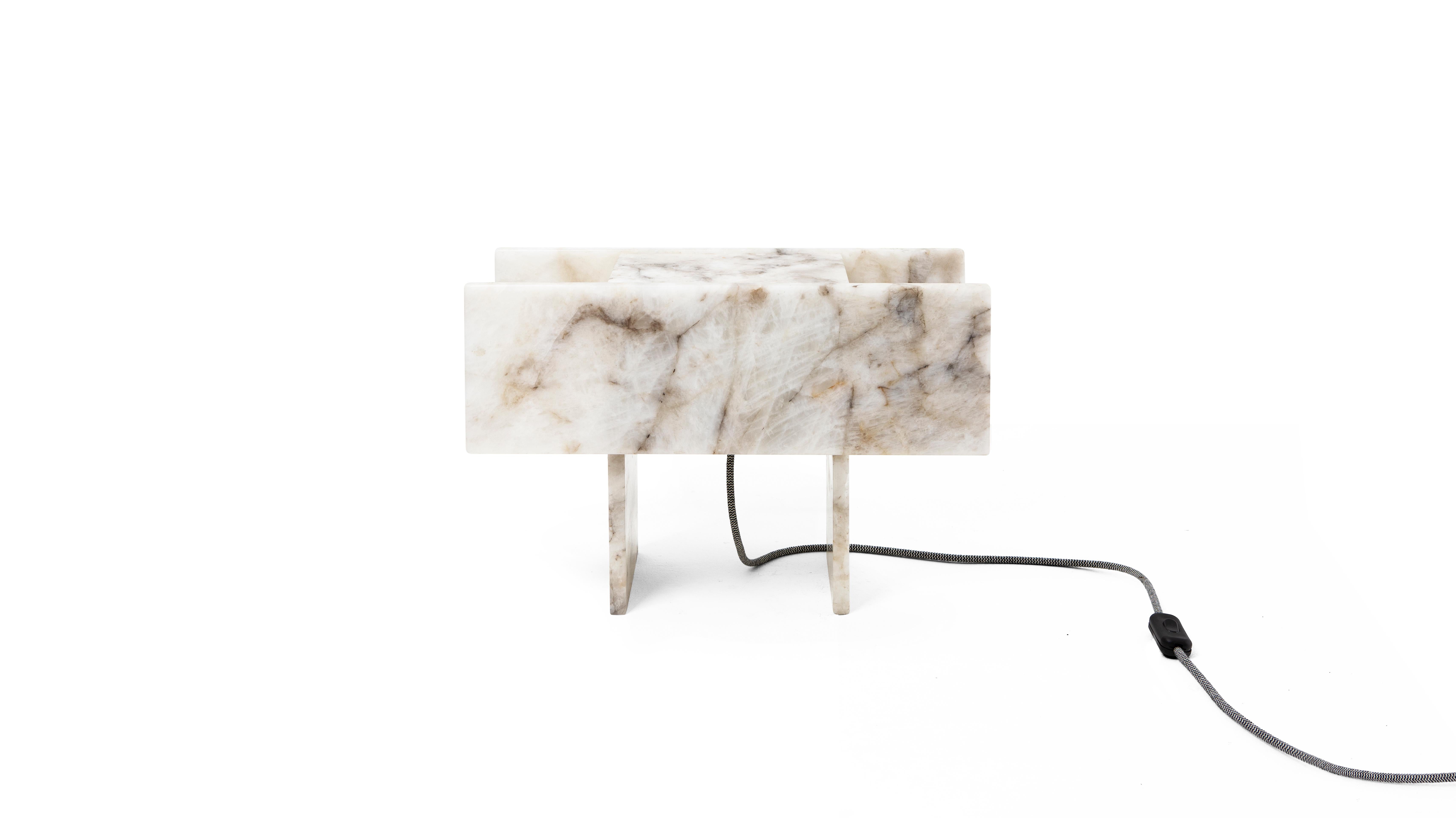 This is Pedrita table lamp (size M)  and is part of Pedrita lamp series.
Pedrita lamp series’ concept is based on an experimentation of Brazilian stones: quartzites and quartz crystals, which are natural, semiprecious and exotic stones found in