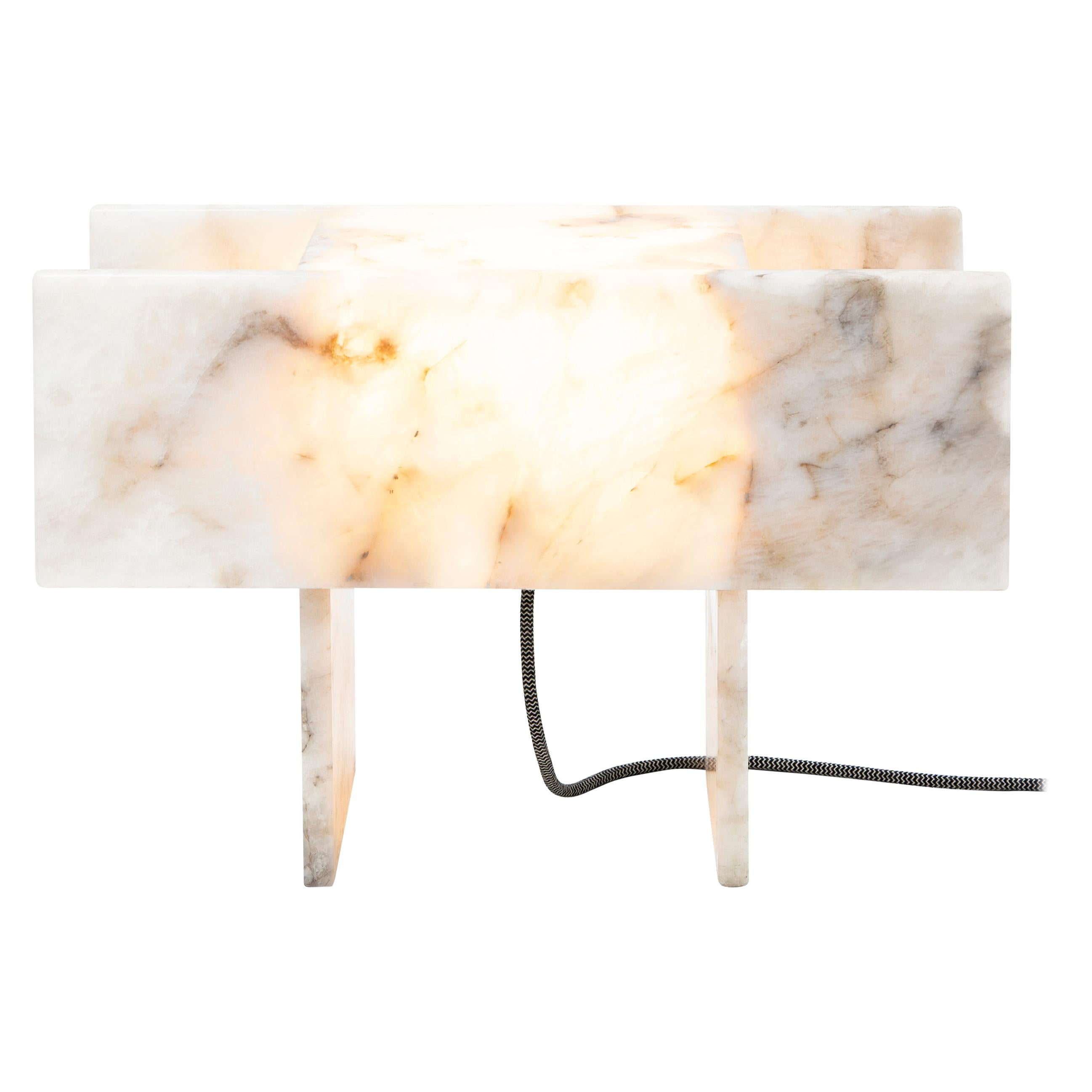 This is Pedrita table lamp (Model M) made of translucent quartz and it is part of Pedrita lamp series.
Pedrita lamp series’ concept is based on an experimentation of Brazilian stones: quartzites and quartz crystals, which are natural stones found in
