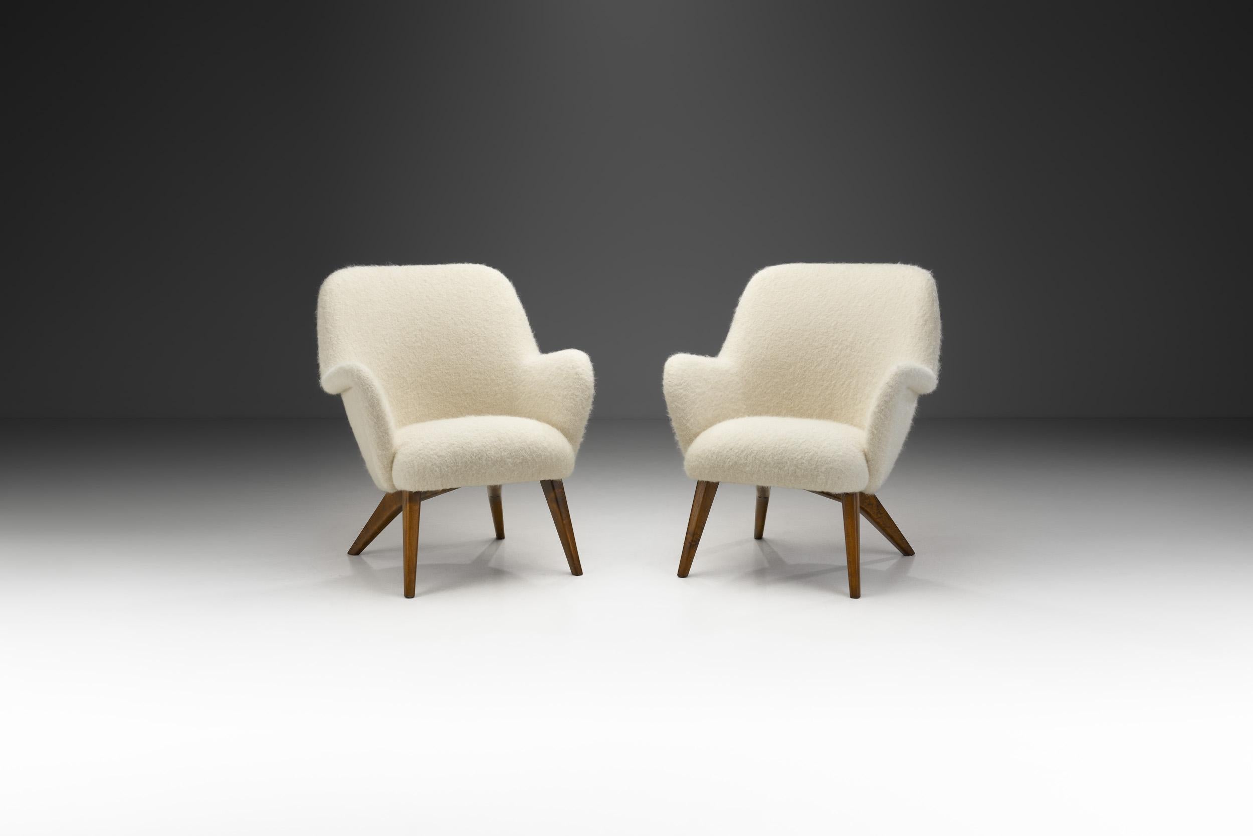 These “Pedro” armchairs show the homely curviness that defined the design of the 1950s. Hiort af Ornäs developed this model for his own furniture company, Puunveisto Oy.

The Pedro model has a soft, sculptural shape paired with an ergonomic
