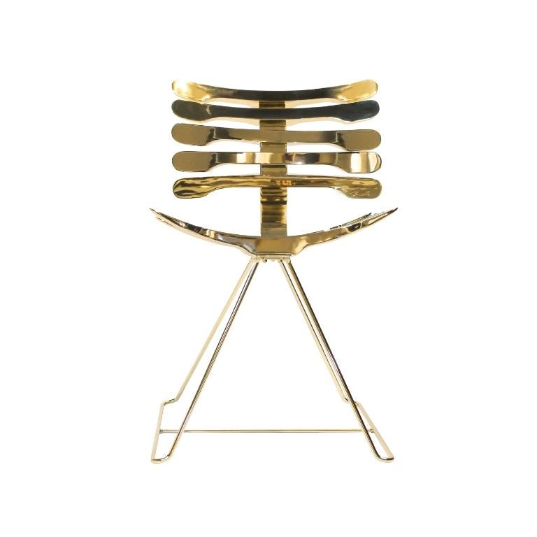 The Esqueleto chair created by designer Pedro Franco is a high quality piece of art design by A LOT OF Brazil, with cast aluminum rods, structure and base in carbon steel. With a golden finish, the piece takes on the look of a jewel. The piece is