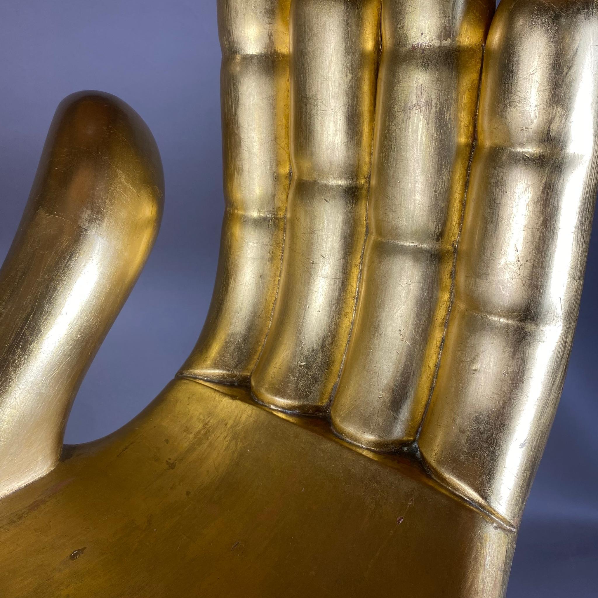 An iconic 1970's carved mahogany wood with gold leaf Hand - Chair by Italian - born Mexican artist Pedro Friedeberg. The piece is a rare finding suitable for collectors of Mexican art. The piece is signed on the base's interior. 

Pedro Friedeberg