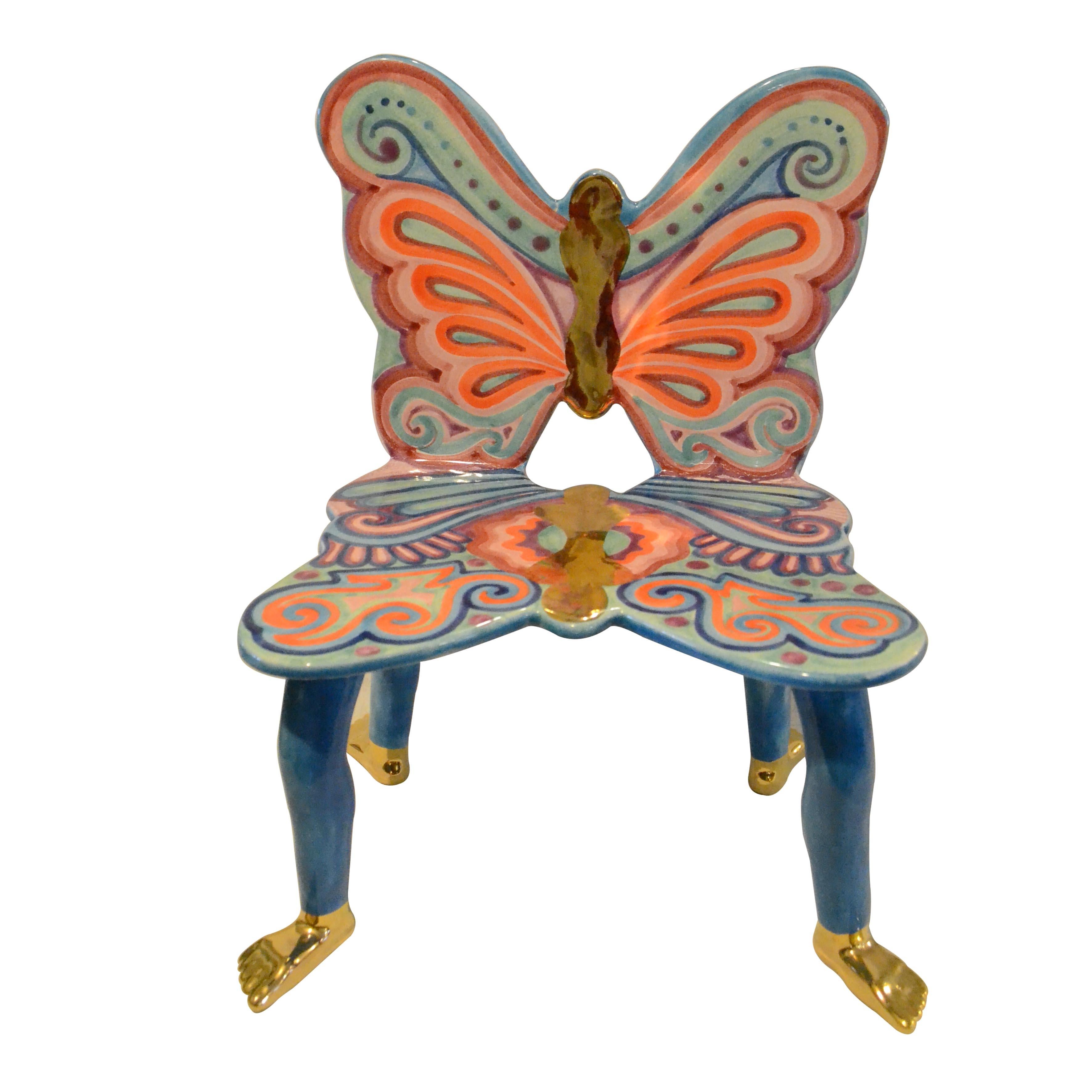 Pedro Friedeberg butterfly chair. Hand painted ceramic sculpture in blue, violet, red and orange with 22-karat gold painting details.

Pedro Friedeberg is a Mexican artist and designer known by his surrealist work filled with lines and colors, as.