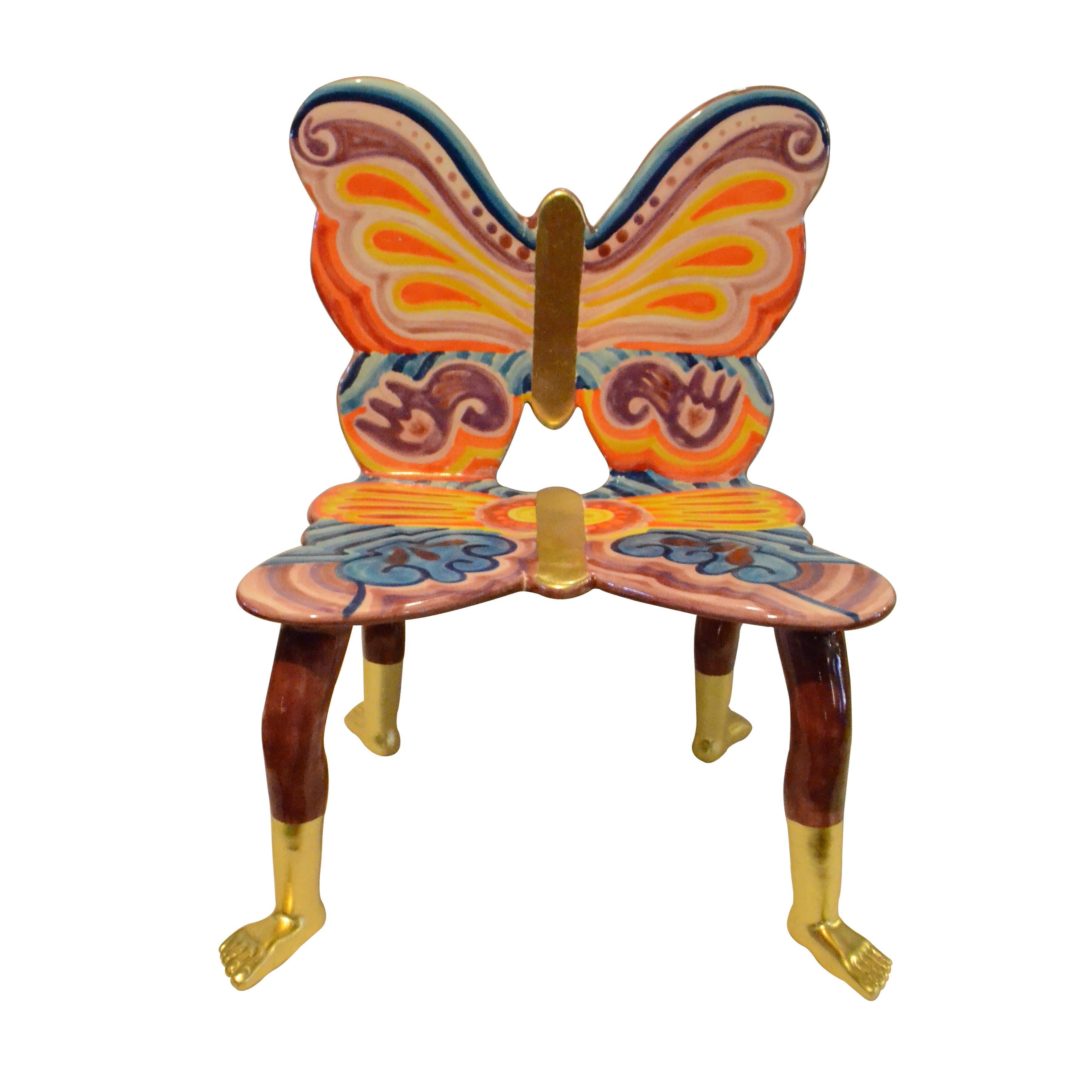 Pedro Friedeberg butterfly chair. Hand painted ceramic sculpture in pink, violet, yellow, blue and orange with 22-karat gold painting details.

Pedro Friedeberg is a Mexican artist and designer known by his surrealist work filled with lines and