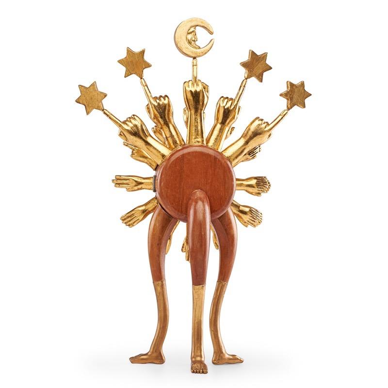 Pedro Friedeberg (b. 1937)

An exceptional, dreamlike Astroclock sculpture by Mexican Surrealist master Pedro Friedeberg, in carved and gilt mahogany with enameled metal. Twelve wryly placed carved gilt hands for the hours radiate from a polished