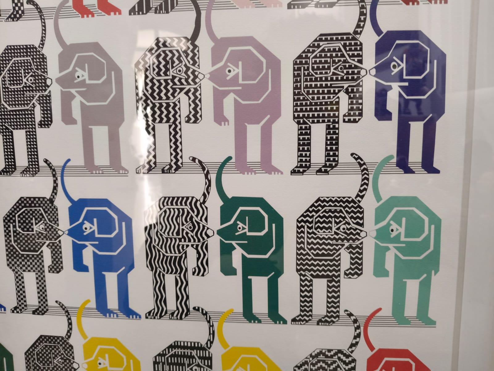 -Pedro Friedeberg signed print featuring a collection of various dogs. Includes whimsical figures, optical art elements, and surreal details. framed in a hand-painted black and gold striped frame. a vibrant example of friedeberg’s iconic vision and