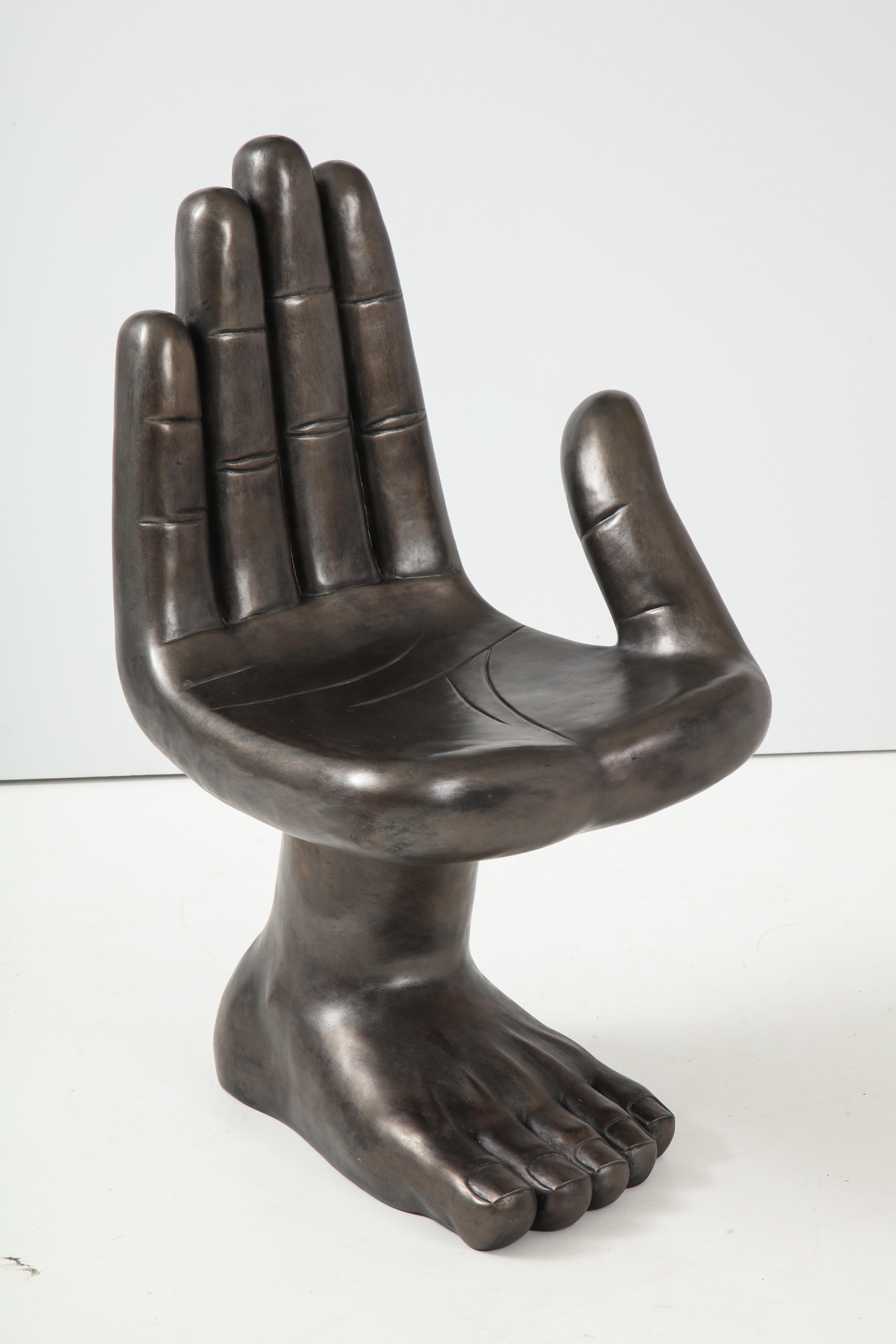 Pedro Friedberg style hand/foot resin/fiberglass chair in a gunmetal finish.