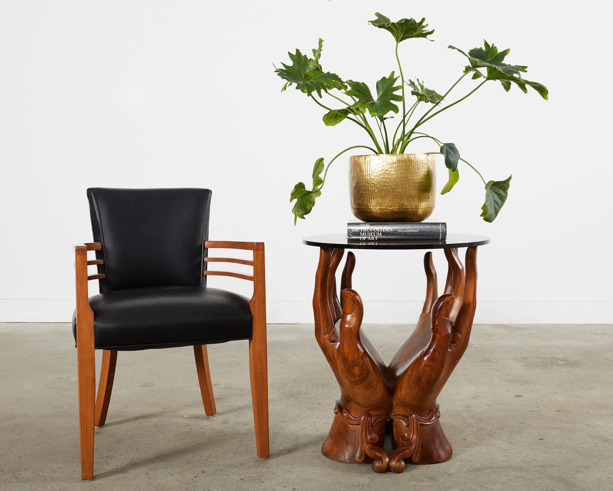 Extraordinary carved walnut drinks table or side table featuring two graceul hands made in the style and manner of Pedro Freideberg. The mid-century modern sculptural carving depicts two hands conjoined at the wrist with decorative swag wrapped