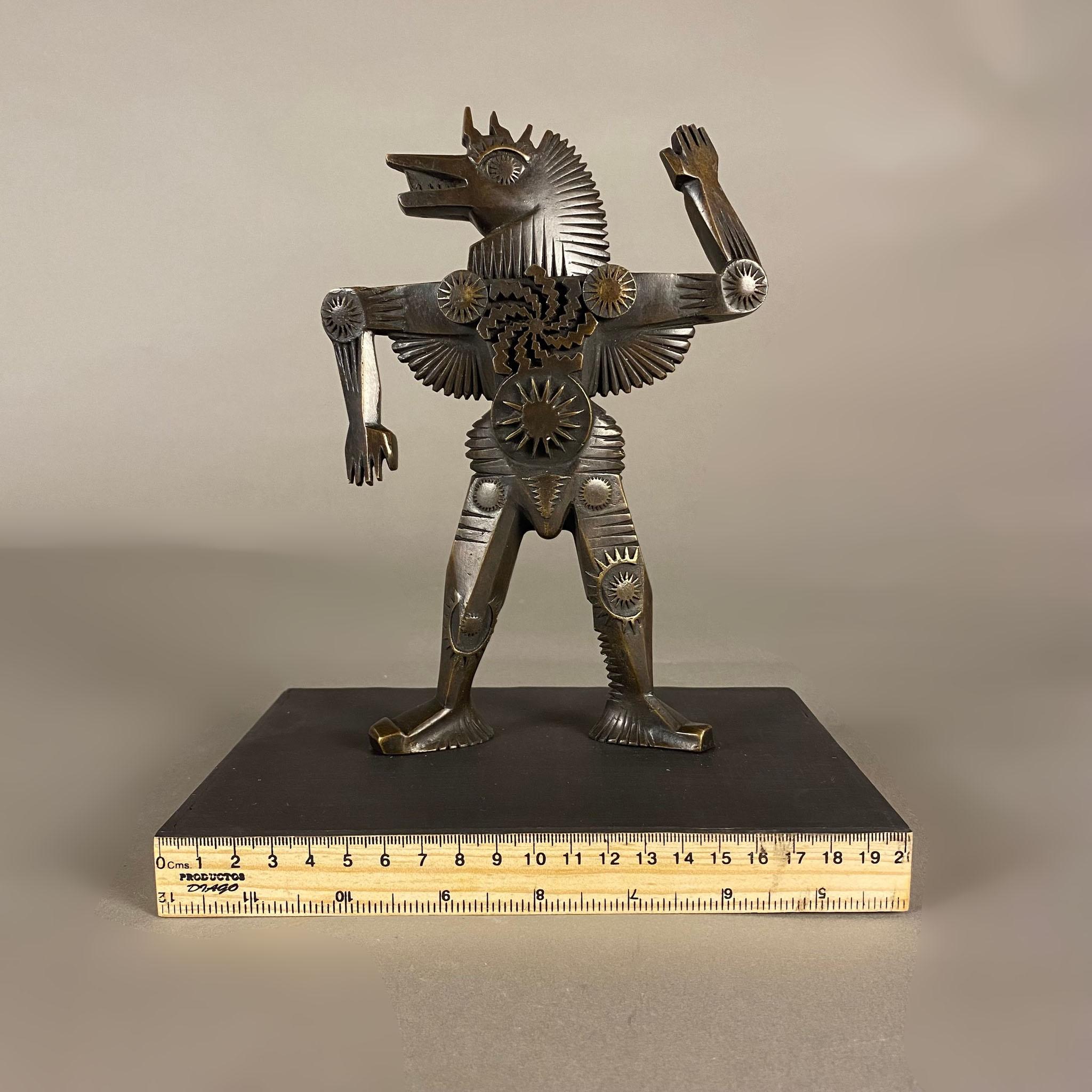 A zebra bronze sculpture by Italian-born Mexican artist Pedro Friedeberg. The zebra's series is 6 / 10 and has a dark patina finish. It is signed on the leg. The sculpture is mounted in a wood base with black floor and wood rulers on its edges. A