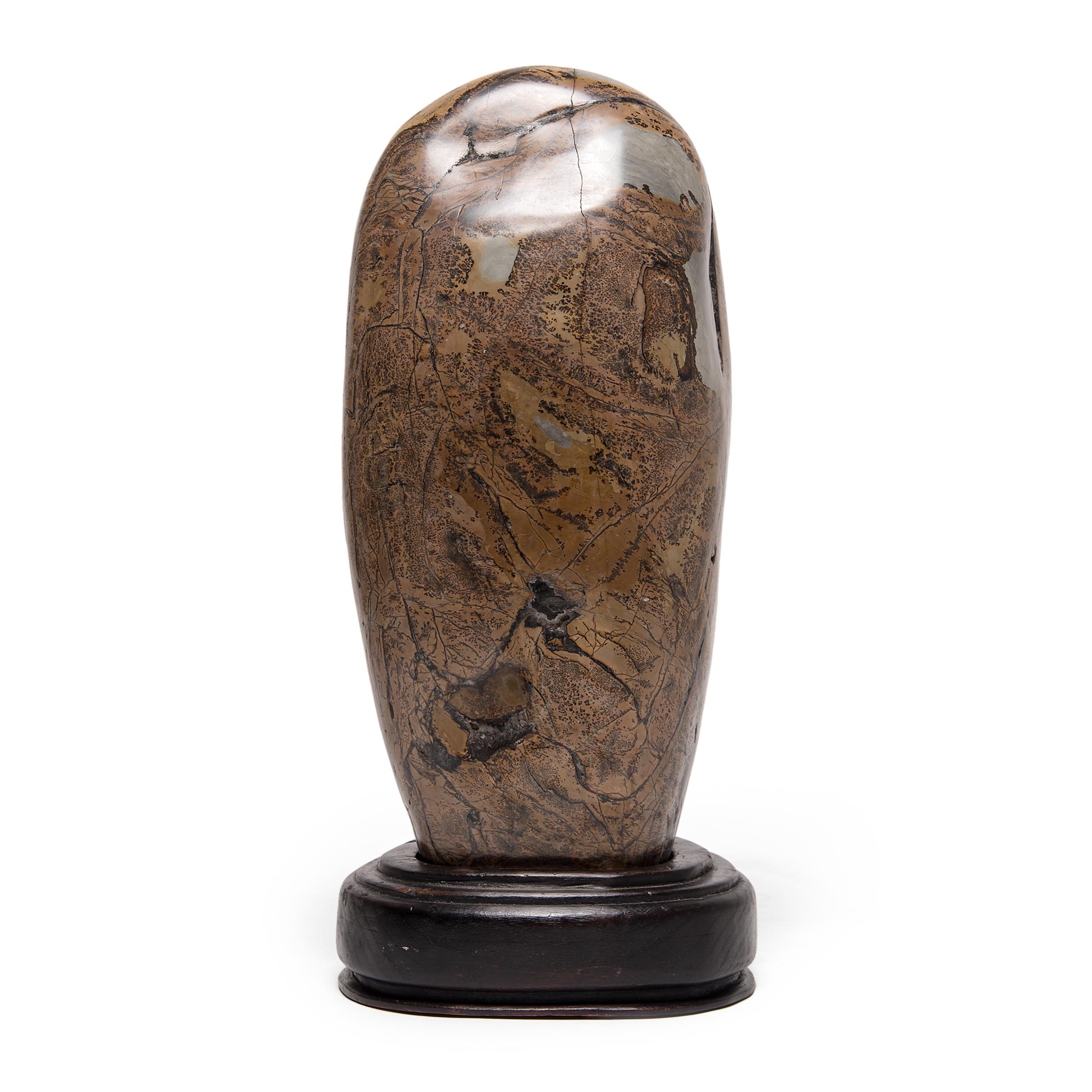 As if brushed with ink and inscribed with intricate calligraphy, this polished jasper stone is covered in spectacular swirls and intricate patterns. Unusual stones such as this one have been appreciated by Chinese painters, poets, and calligraphers