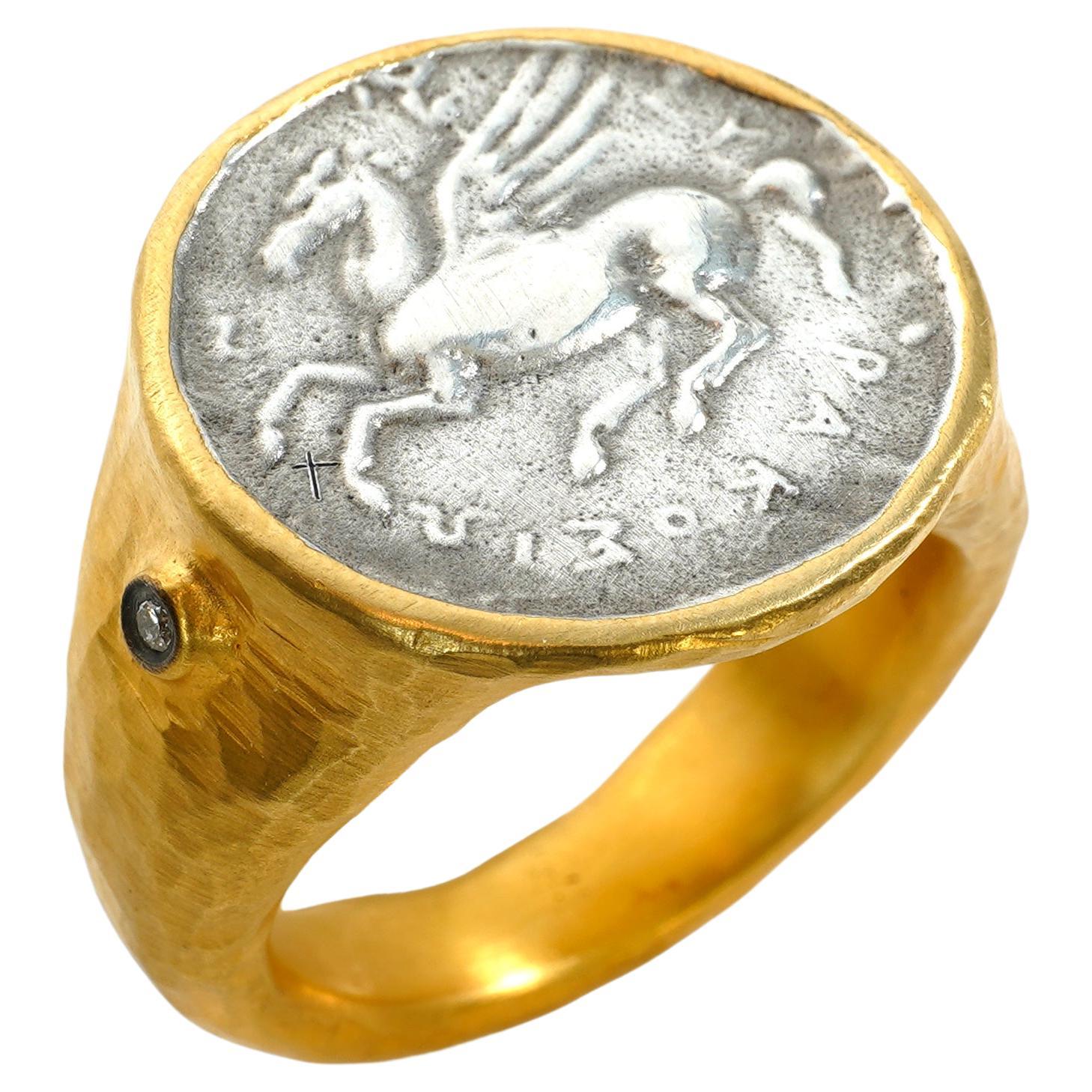 Pegasus Coin Ring with Diamonds, 24kt Gold and Silver, Kurtulan 24kt gold-fused on sterling silver. 
Size 7 (US) is in stock;  Diamonds: 0.02ct.
*Sterling Silver Coin is a replica of one in the Turkish Museum
*Video shows a bee-coin ring but the