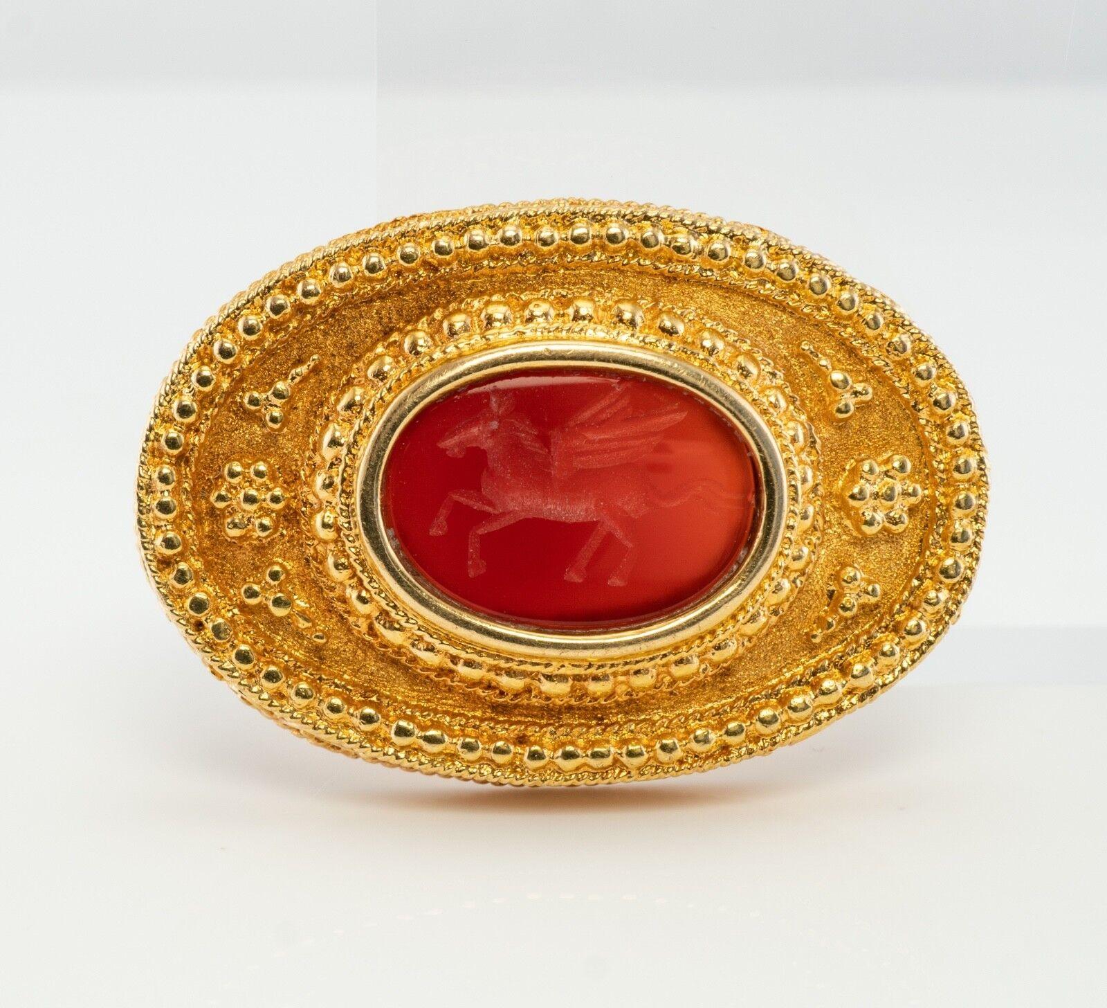 Pegasus Pendant Brooch Carnelian Cameo Ancient Greek Mythology 18K Gold

This gorgeous estate Etruscan style piece is finely crafted in solid 18K gold. It is also stamped with a hallmark.The center carnelian intaglio cameo depicts a Pegasus horse.