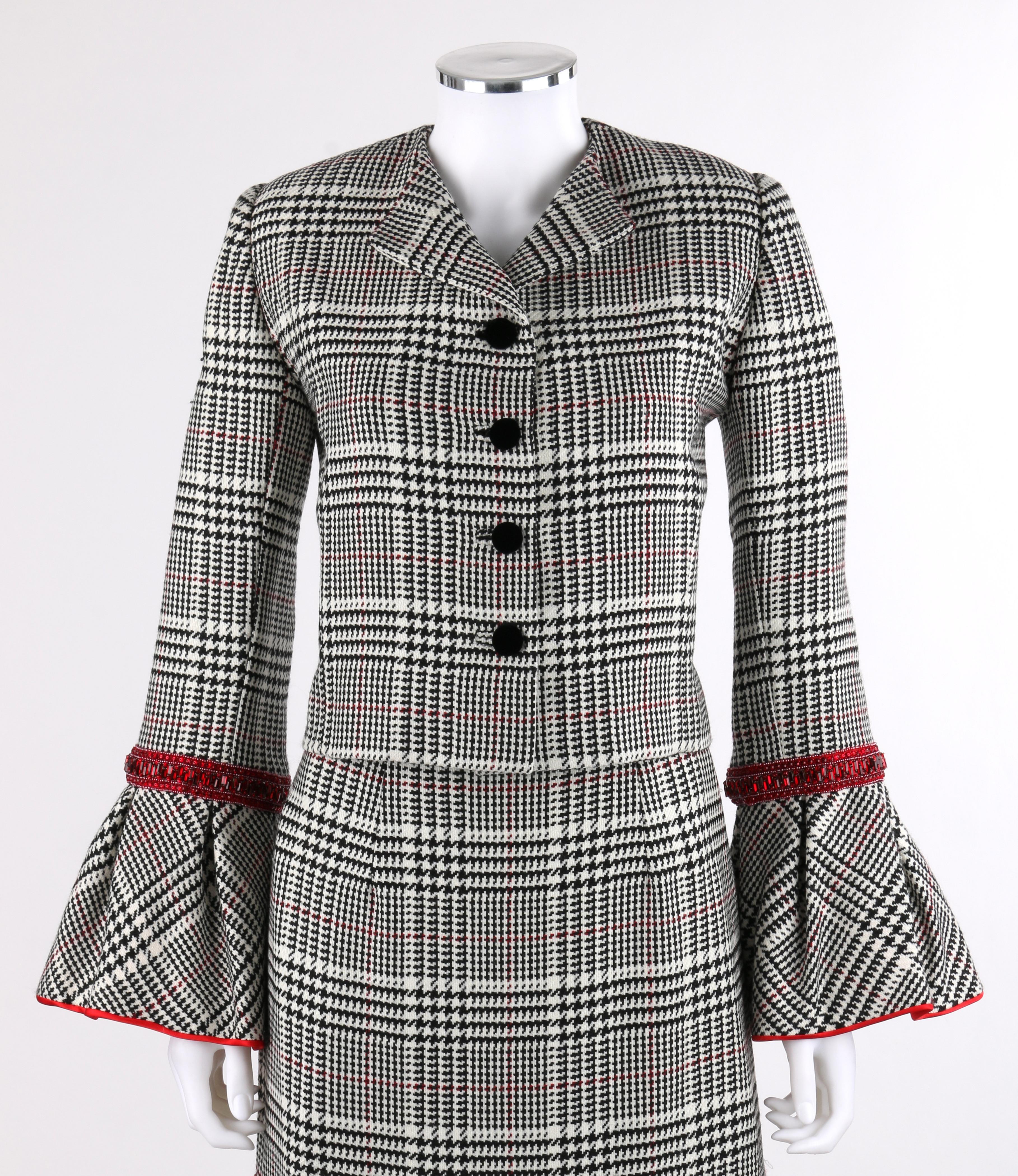 PEGGY JENNINGS Couture Black White Houndstooth Ruby Red Trim Trumpet Skirt Jacket Dress Suit
 
Brand / Manufacturer: Peggy Jennings / Couture
Designer: Peggy Jennings
Style: Two piece skirt suit
Color(s): Shades of Black, white, and red
Lined: Yes
