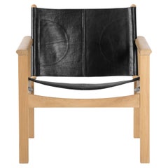 Peglev Black Leather And Oak Armchair by Objekto
