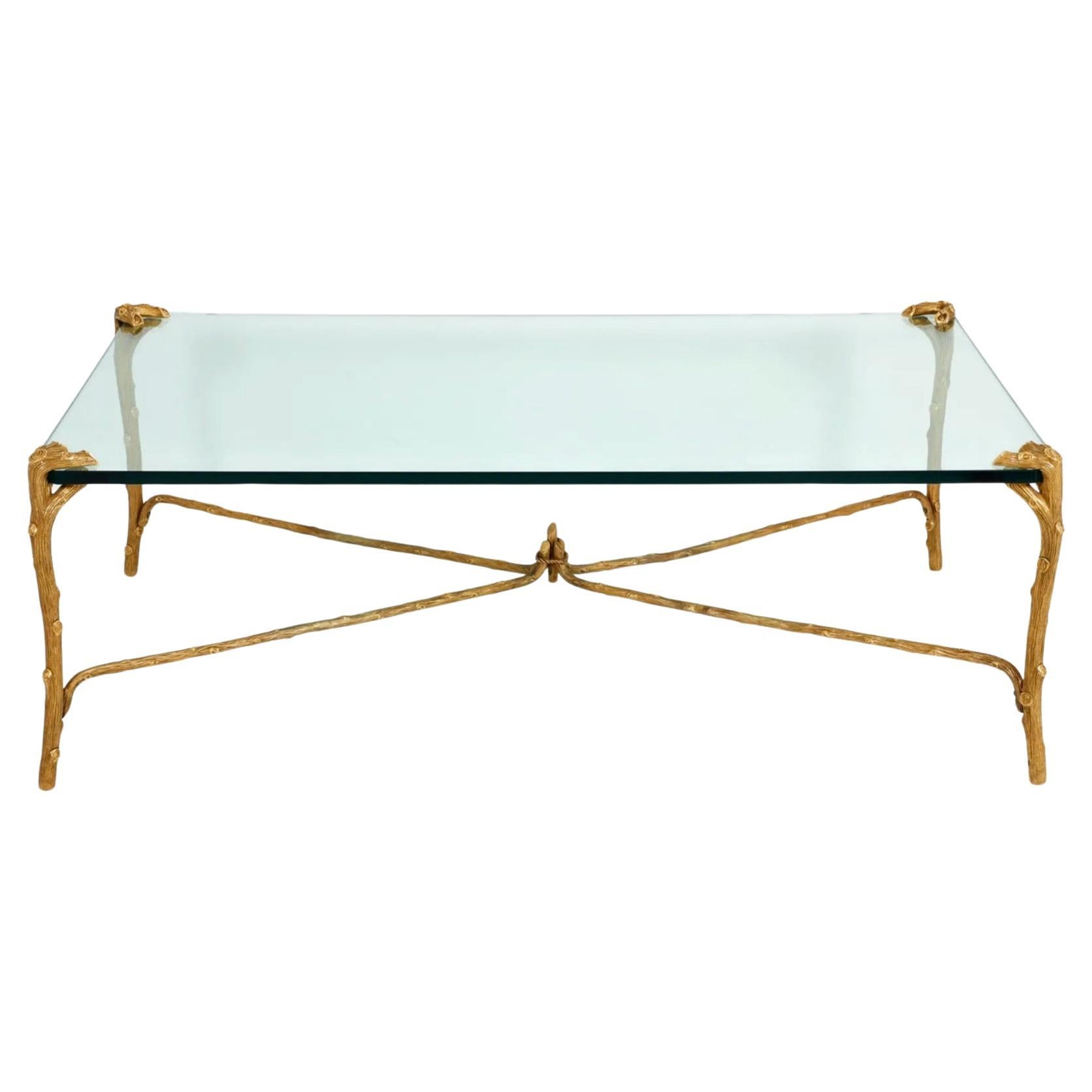 This is a stunning bronze large P.R.Guerin coffee table that dates to c. 1965-1980. This particular P.E. Guerin coffee table is in the highly desirable faux bois form. The table is finely cast of bronze which is subsequently hand chiseled and gold