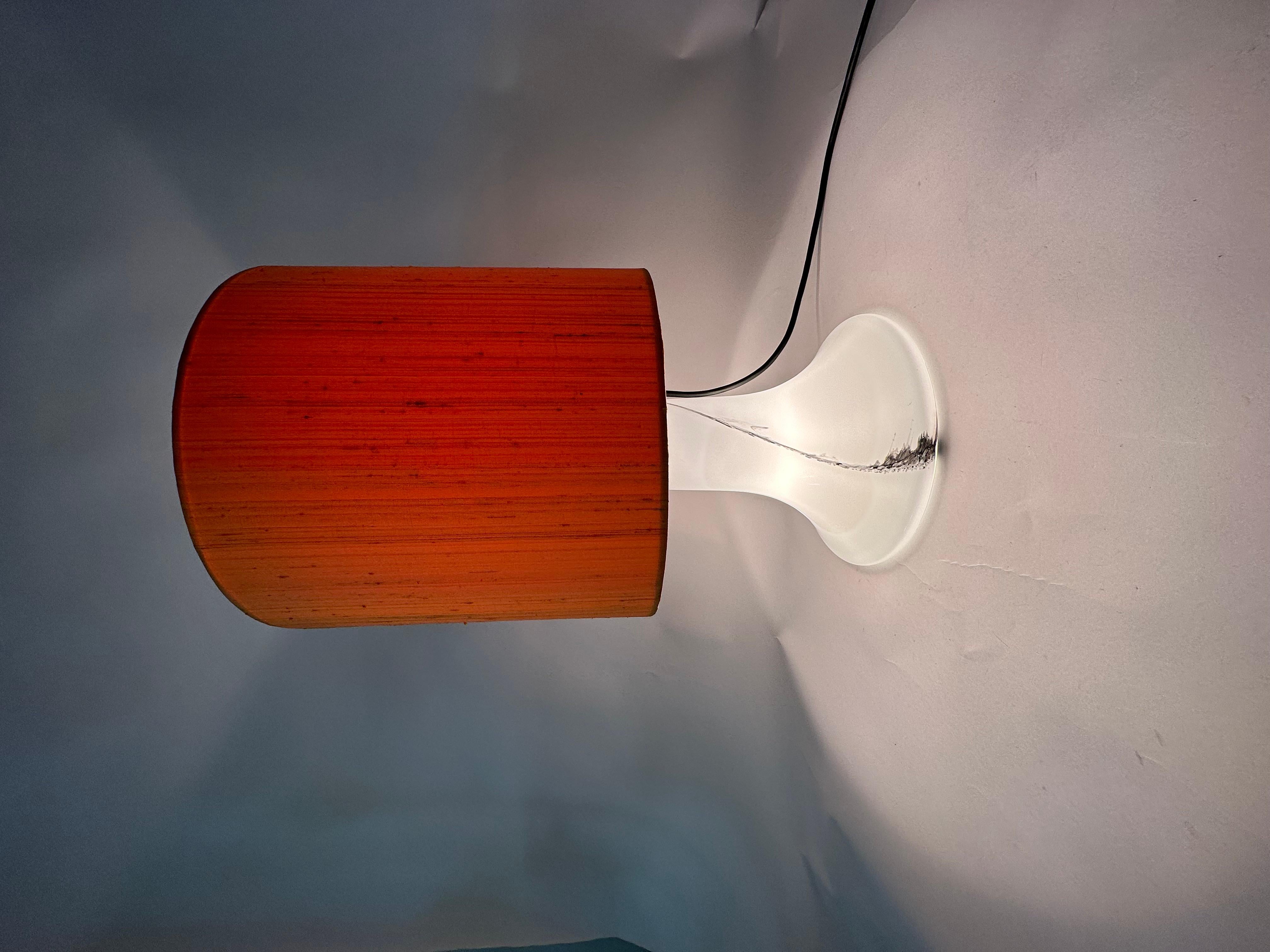 Peil & Putzer glass table lamp , 1970's

Dimensions: 53cm H, 33cm Diameter
Material: Glass, fabric
Manufacturer: Peil & Putzler
Color: White , orange , black