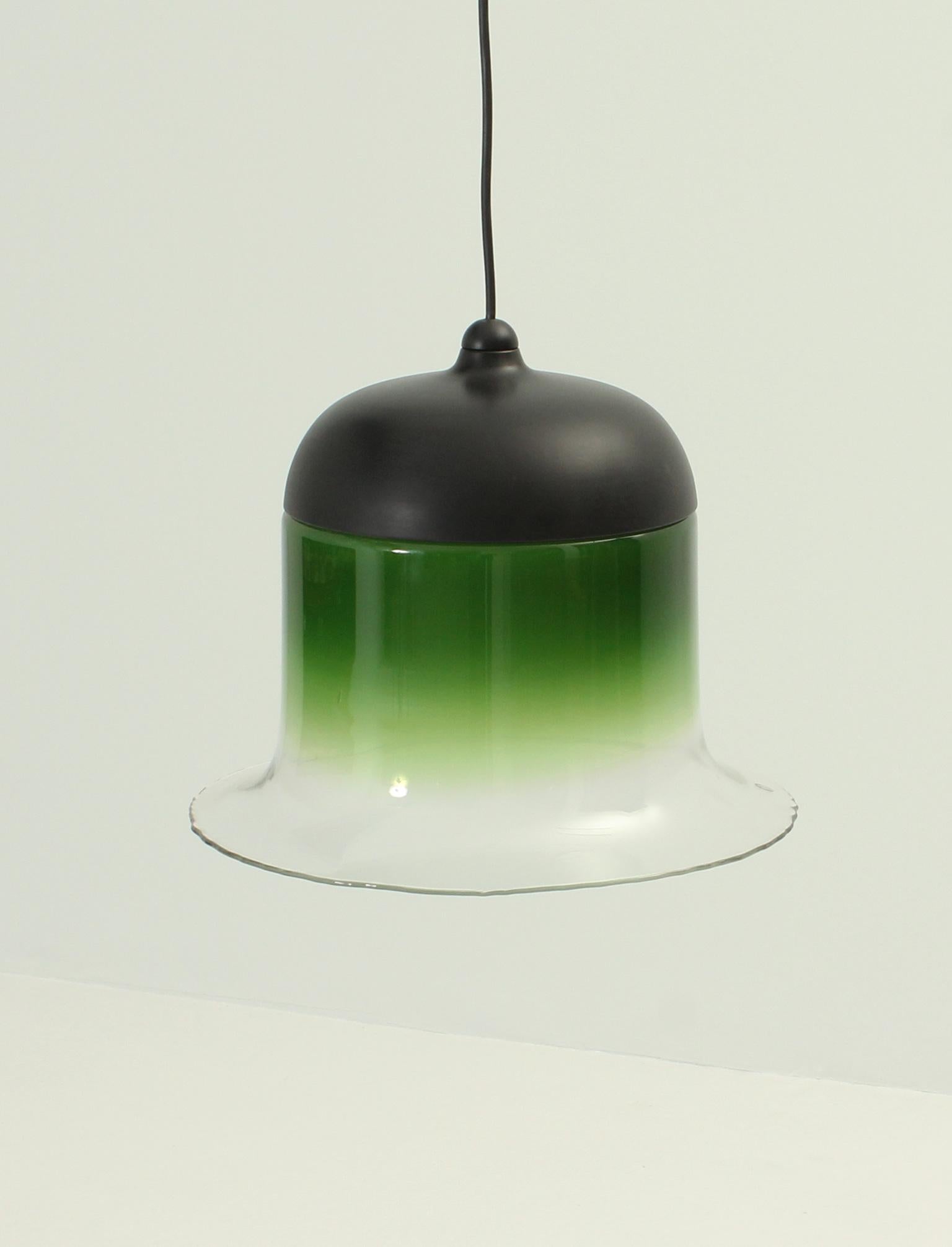 Ceiling lamp designed and produced by german company Peill & Putzler in 1972. Hand blown coloured glass and enamelled aluminum dome. This is the wide version of this lamp that imitates the effect of the projection of light in the colored part of the